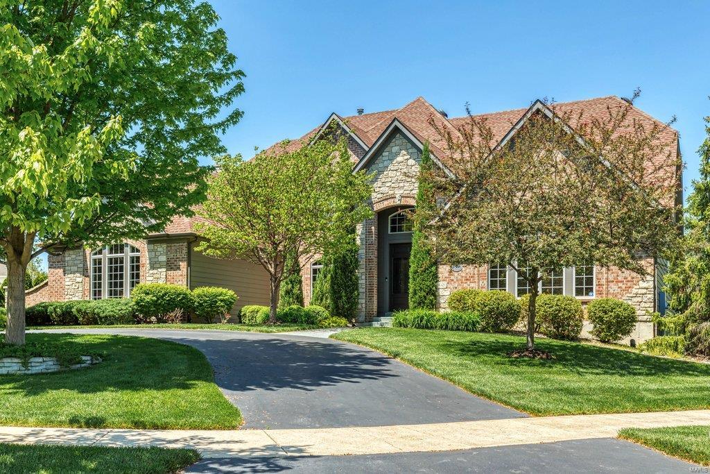 An impressive brick & stone elevation highlights the remarkable curb appeal of this spectacular Fischer & Frichtel-built 1.5 Sty. Located in gated Spring Mill Estates. 2-Sty foyer leads to private study with etched glass doors, elegant dining room framed by architectural columns & stunning great room with built-in bookcases, wet bar & dramatic 2-sty bow window. Designer kitchen with 42” cabinetry, granite countertops, premium appliances, butler’s pantry & convenient planning center adjoins light-filled breakfast room with sliding glass door to patio & hearth room with floor-to-ceiling stone fireplace. Coffered master bedroom suite radiates warmth with a direct vent fireplace, wide bay window & luxury bath with jetted tub. The 2nd floor extends the living quarters with 3 additional bedrooms, 1 with ensuite bath & 2 with Jack n’ Jill bath, & bonus room. Walk-out Lower Level includes recreation room & game room with see-through linear gas fireplace, workout room, 5th bedroom & full bath.