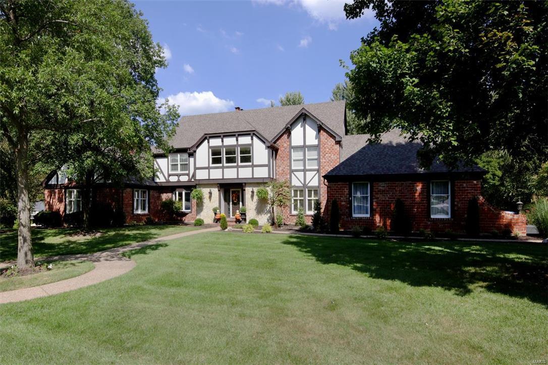 This sophisticated 1.5 story 5 bedm, 4.5 bath home has over 6500 sq. ft of total living space with updates galore! The magnificent two-story entry w/ sweeping split staircase is a grand centerpiece. The gourmet eat-in kitchen features new granite counters,new marble backsplash, new lighting, updated cabinetry, stainless appliances and fresh lighting. Adjacent to the kitchen,the main floor family room is cozy & light filled with its built-in bookcases, gas fireplace & access to the back deck. The master suite & sitting rm w/gas fplc are a true escape complete with a recently renovated master bath.The formal living & dining rooms are light filled and add to the ease of entertaining. The upstairs bedrms are generous in size. There are 2 recently updated hallway baths that serve the bedrooms.The finished walk-out lower level includes a large wet bar, full bath,multiple living areas & plenty of storage. A 4 car garage, main flr laundry & great outdoor living spaces add to the ease of living