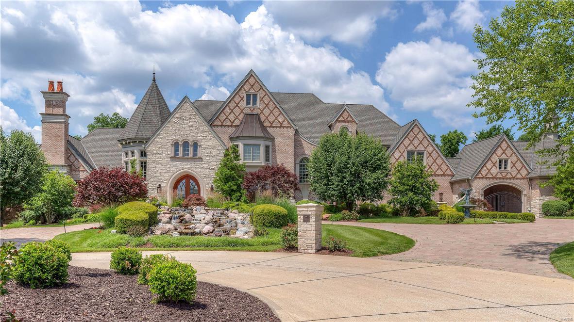 Architecturally significant home in premier gated neighborhood! Extraordinary craftsmanship, superb architectural finishes & high tech integrated systems. 2-sty foyer highlighted by dramatic floating staircase opens to paneled library w/ limestone fireplace, exquisite dining room & spectacular great room w/ wet bar & hand-carved fireplace. Exceptionally large kitchen has professional quality appliances, custom-built-ins & limestone flooring that flows into the adjoining breakfast room & hearth room. Barrel-vaulted master bed suite w/ stone fireplace, dressing room & beautifully appointed bath. The 2nd floor has 4 additional bedrooms, 2 w/ ensuite baths & 2 with Jack n’ Jill bath, family room & loft sitting room. Pool lounge w/ gathering bar & wine cellar, billiard area, family room w/ floor-to-ceiling FP & media room and workout room & pool bath are featured in the walk-out LL. Impeccably landscaped 3-acre grounds include veranda, outdoor family room, pool, hot tub & 2 & 3-car garages.