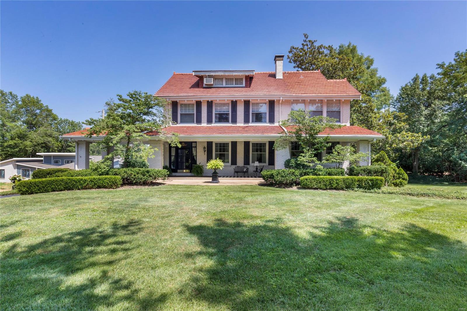Experience a harmonious blend of classic elegance and modern luxury in this stunning 113-year-old Ladue residence. The 4-level, 5,400 sq. ft. home is steeped in style, from the tastefully updated interiors to the charming historical architectural details.  Enjoy the freedom of space with 5 BR's (ensuite Master with sitting room), 4.5 baths, elegant dining and living rooms, office/music room, 2 full kitchens, 2 laundry areas, a 4-season sunroom with windows galore, an outdoor seating area with a retractable awning, and endless storage areas.  The 3rd level serves as a separate guest suite and the walk-out basement, already furnished with a full kitchen and bath, can easily be transformed into another.  Centrally located, this home provides easy access to highways, local amenities, and excellent public and private schools in Ladue. This exceptional property has been a beloved home for several families over the years - it's now ready to become the perfect home for yours. Additional Rooms: Sun Room