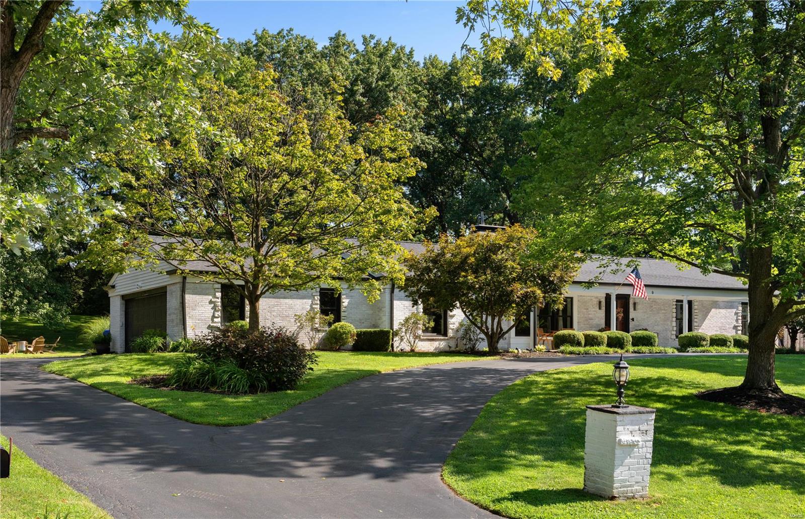 Nestled in the prestigious Villa Coublay neighborhood within the renowned Ladue School District, this light-filled ranch-style home seamlessly blends charm and comfort. With five bedrooms and 3.5 bathrooms, it's perfect for families of any size. As you step into the entryway, you're greeted by abundant southern light flooding the living room, creating a warm atmosphere. The kitchen boasts top-tier appliances, a central island with a breakfast bar, and ample storage, including a pantry. From here, step onto the patio complete with an ample sized pool and beautifully matured landscaping. The fully finished lower level adds versatility, featuring an extra bedroom, a full bathroom, a fitness room, and various entertainment spaces. The home also offers a convenient side-entry two-car garage, parking pad, and a circular drive, ample room for parking. Enjoy the perfect blend of comfort and relaxation in this home, where every detail contributes to a welcoming living environment.