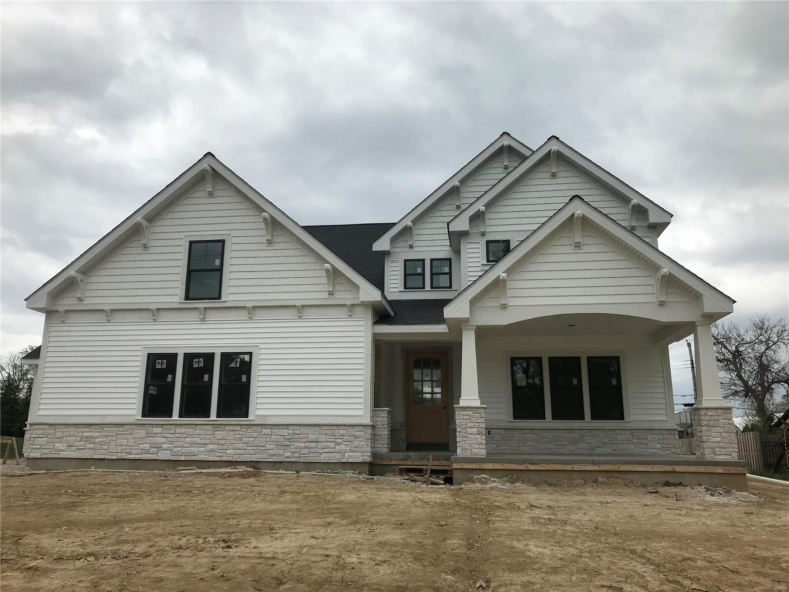 Spectacular modern farmhouse 1.5 story under construction by Boulevard Custom Homes.  This 5 bedroom, 4.5 bath, home features astounding finishes which include a 3-car side entry garage, metal roofs, hardwood flooring 1st floor and 2nd floor hall, gourmet kitchen with true custom cabinetry, large island and peninsula counter, crown molding, soft close drawers, 3 lazy susan's, pull-out spice rack, trash pullout, Quartz countertops, stainless steel appliances, under cabinet lighting, large walk-in pantry, built-in lockers, and impressive screened in rear porch.  12' high beamed ceiling in great room offers a fireplace, wine bar with wine cooler,  den/study with wainscot. Elegant master bath suite has coffer ceiling, large walk-in closet, adult height vanities, stand alone tub in master bath.Other amenities include mahogany wood front door, LP Smartside prefinished siding, wood treads on stairs,expansive 2nd floor bonus room, 2 full baths on 2nd floor, large bedrooms with walk-in closets. Additional Rooms: Sun Room