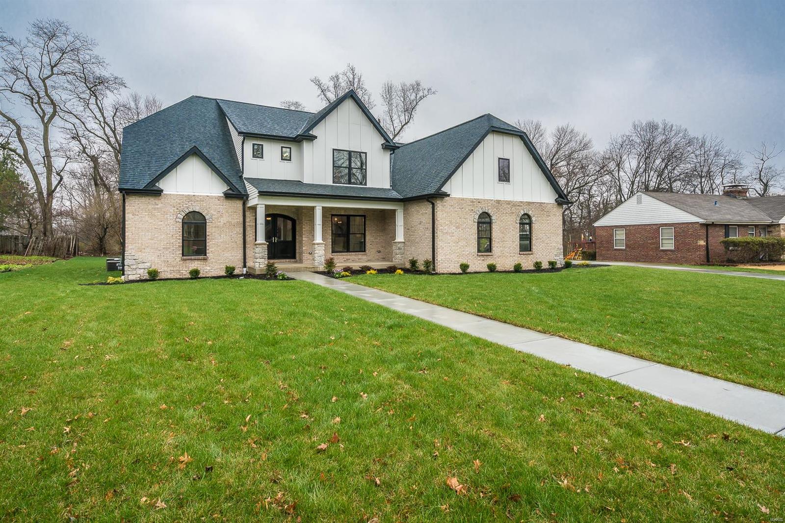 Nestled in the exclusive "Stoneleigh Towers" Subdivision, this 5B/6 Ba New Construction home is a "MUST SEE"! Located in the Ladue school district, this house combines luxury and elegance with all the "Bells and Whistles"! Open Floor concept with 9 ft Ceilings  featuring black Pella Windows and custom Mill-work throughout. Chef's kitchen includes custom Cabinetry, High End appliances, 48" Range w/ Hood, dry-bar, and walk-in pantry. Main Floor Master boasts His and Her Vanities, Walk in shower, Free-standing tub and an impressive Walk in Closet. 3 additional bedrooms upstairs with 2 baths (1 J/J, 1 hall) and  Loft Area. This house has it all! Finished walk-out basement includes an additional bedroom  and 2 full bathrooms with a large recreation area and ample storage. 3 car side entry garage custom doors, Dual Zoned HVAC, 2 Laundry rooms, Indoor/outdoor fireplace, Mud-room, concrete patio and the list goes on. This house will not last long, come see it today!