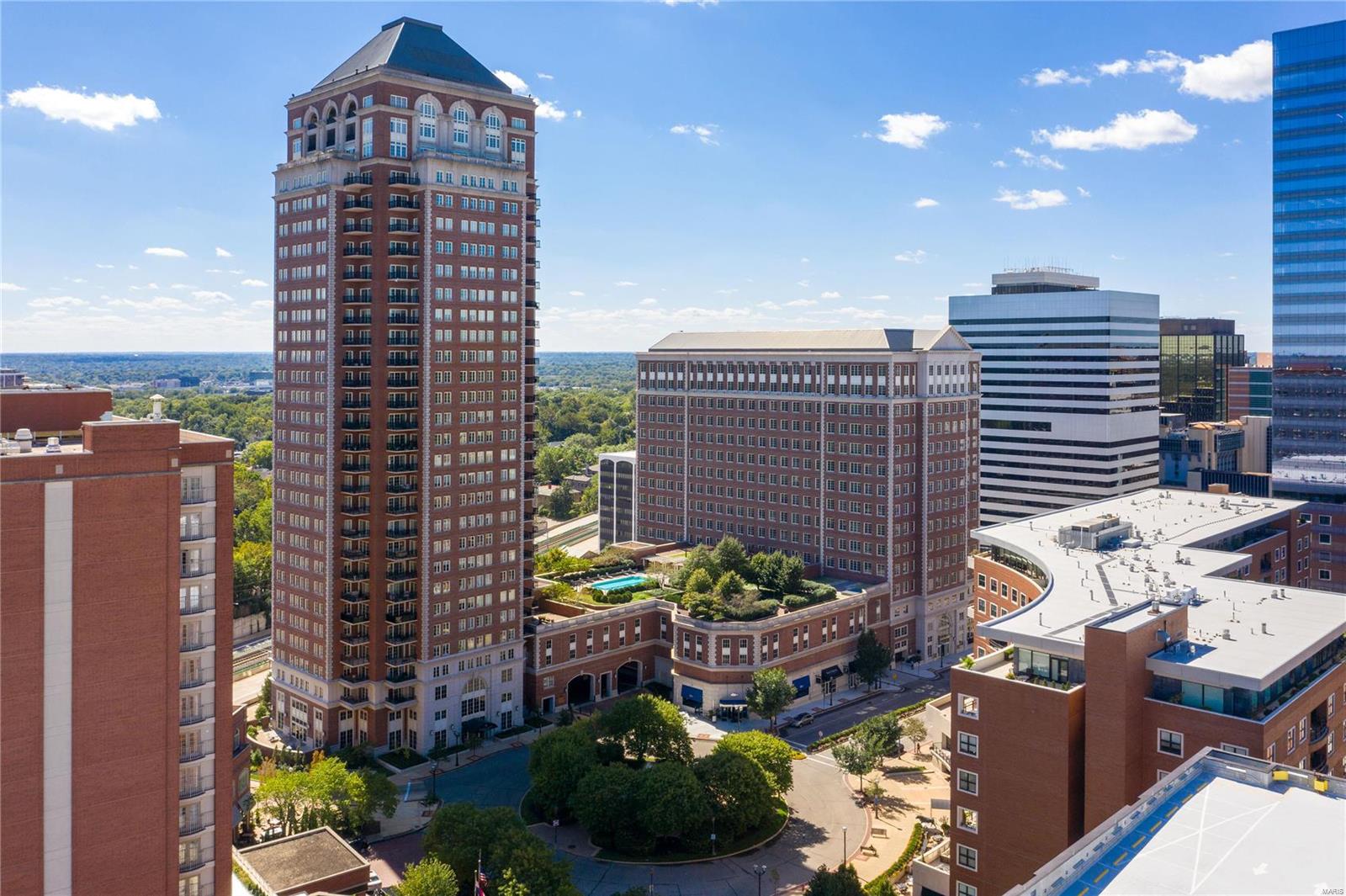 Located in the heart of Clayton, The Plaza is St. Louis's most prestigious address for condo living.  The amenities are endless and the services provided are unmatched.  This beautiful unit is on the 14th floor on the South east corner with a view of the Arch and residential areas.  It has a very transitional gracious feel with wood flooring, custom moldings/built ins & upgraded light fixtures.  The formal entry leads to the  living and dinning rooms with two private covered balconies for entertaining.  The kitchen has custom cabinetry, stainless appliances, gas cook top with hood, wine cooler at bar area, wood flooring and solid surface counters.  The breakfast room with large windows adjoins the family room with tile flooring, wonderful built in cabinetry and two walls of windows for beautiful views.  The master is very large with private sitting room, 2  Walk in closets and private glamour bath.  2 additional bedrooms, each with their own bath, are on the opposite side of unit. Location: Upper Level
