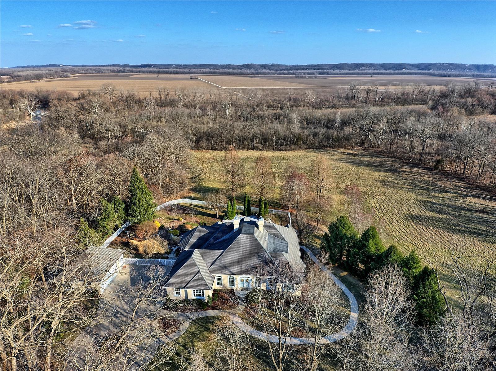 Pampered by original owner since its 1999 birth. 6300 square feet of gracious living area built with the true entertainer in mind.
    Home is nestled on 8.1 acres and includes adjoining 8.61 building lot for a total of 16.71 acres MOL. Other features included is
a heated inground piano shaped pool, two car detached garage with full bath plus 3 car oversized side entry, The view is incredible from the massive wall of the great room windows not to mention from the pool deck. The home has everything needed to plan the perfect family and friends gatherings. Resort like living right at home! See photos. Showings begin with open house Sunday March 21st from Noon to 4:00PM. Additional Rooms: Mud Room
