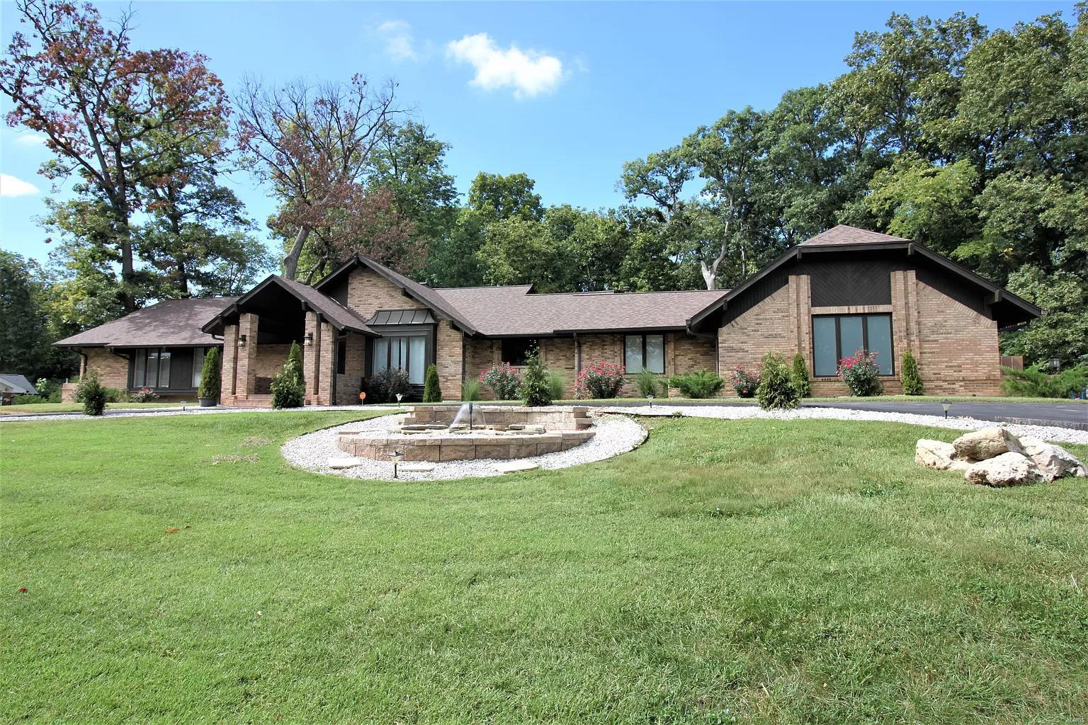 Opportunities, such as this, are rare to come by. This magnificent home, 3600 sq ft ranch, on a scenic 1 acre lot in exclusive golf community & Parkway SD is waiting for its new owner. Exquisite finishes & modern comforts interplay w/ unique yet functional floor plan throughout the gracious & inviting space. The great rm is worthy its name w/vaulted ceiling and floor to ceiling fireplace. Spa like master suite walkout to the imported travertine & porcelain deck, many windows that allow you to enjoy the peaceful views of the back yard along w/ wild-life. The Dining Rm is framed w/ display shelf & molding. W/O lower level w/2nd kitchen, bdrms, plus theater & bar double the square footage. Complete privacy w/resort like setup, 1500 sf porcelain patio that leads to 1700+sf inside area to the heated pool w/retractable roof, waterfall & hot tub. Other features incl. elevator, new roof & HVAC, updated systems, pool equipment w/i 2 yrs. What a great value for all the luxury w/ total privacy Additional Rooms: Sun Room