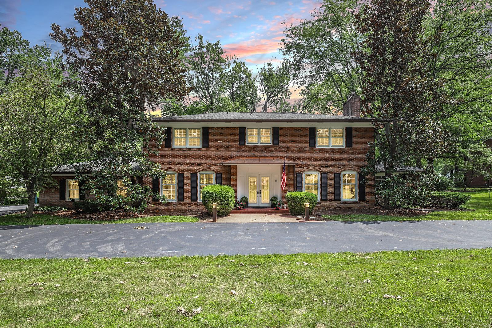 Stunning 2-Sty on .85-acre lot, in the prestigious Frontenac Estates subdivision! Boasting over 5,300 sqft of living space including the professionally finished Lower Level! Artisan leaded glass front doors into the Foyer, light & airy Family Room with WB fireplace & Den with French doors. Gourmet Kitchen with custom cabinets, granite, large island/breakfast bar, Thermador appliances & adjoining Breakfast Room with planning desk. Butler’s pantry & formal Dining Room with 2 sets of French doors! Wonderful 4-Seasons Room, lovely Powder Room & awesome built-ins & sink in Laundry/Mudroom. Amazing Master Retreat with huge custom closet & luxury Bath with dual vanities, jetted tub & walk-in shower. Highlights: newer roof, new zoned HVAC (2023), tankless WH, newer circular driveway & 2-car attached garage. LL with a large Rec Room, built-in bar, amazing Hobby/Craft Room & 4th full Bath. Relax & admire the private backyard, complete with stamped concrete patio & a wood timbered gravel area! Additional Rooms: Mud Room, Sun Room