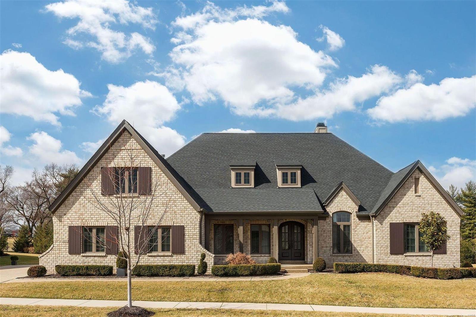 When only the finest in life will do, this exquisite contemporary home, located in a gated community, will completely exceed all expectations.  The home features an open and airy floor plan w/a custom-designed entry door, dramatic soaring ceilings and a luxurious great room w/ fireplace. Transom windows across the back exterior wall showcase the home’s design features and attention to detail. Expansive glass doors open to a beautiful backyard terrace with a gas fireplace and barbeque area. Parking includes a two-car garage and a third independent garage for golf cart, auto, or storage.  This elegant home offers a spacious master suite with stepped up cove ceiling & luxe bath w/ soaking tub and walk-in closet.  Two en-suite bedrooms on the main floor are in a separate residential wing.  All closets are finished with designer storage systems.  Top-quality finishes are found throughout this stunning home.