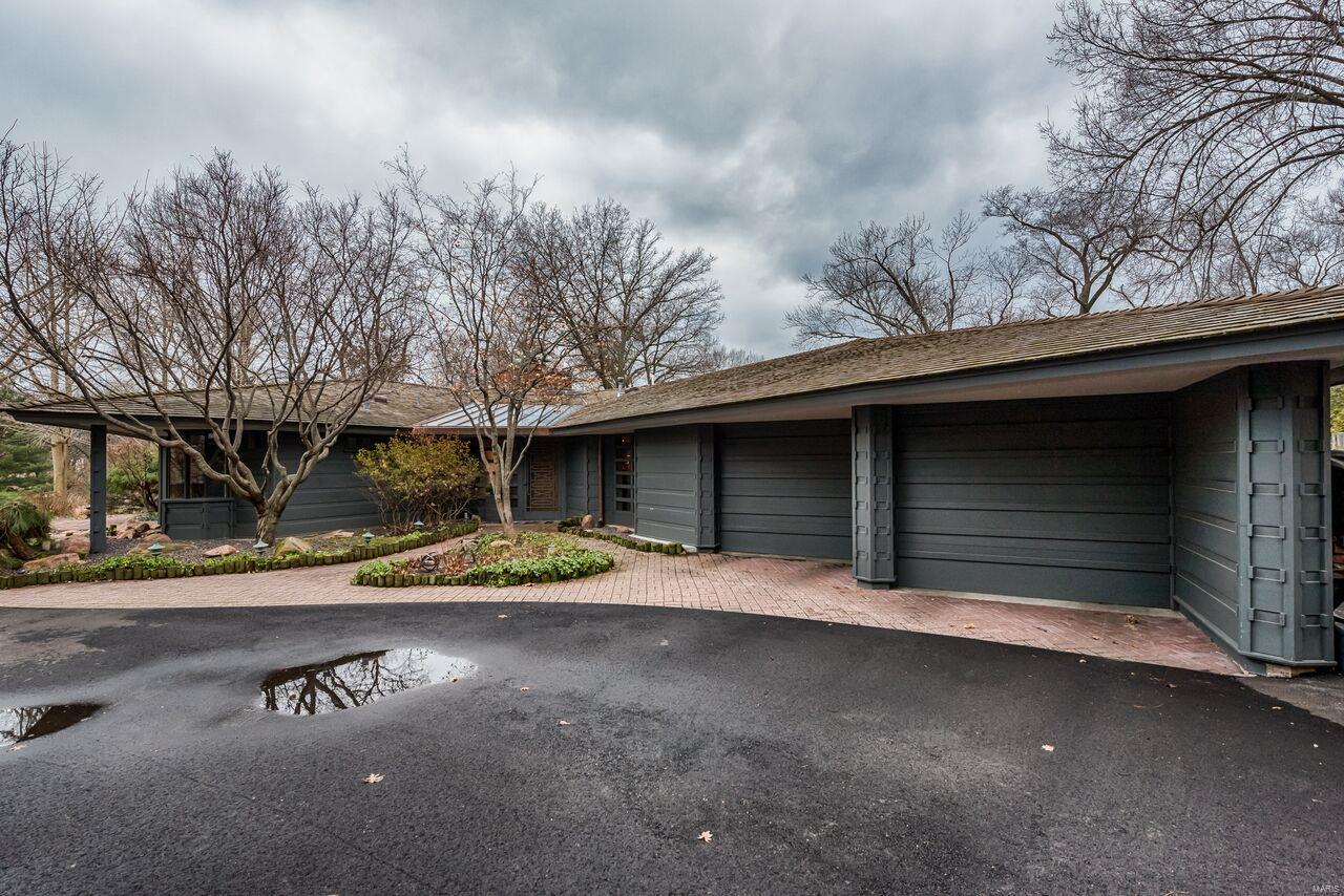 Architecturally significant home known as The Simms House, designed by the firm of Bernoudy-Mutrux in 1952.
Unique features include vaulted ceilings, cypress wood paneling, colored concrete floors, built-in sofas in LR, and fireplace in kitchen. Expanded primary suite with shower, large tub,  2 vanities and 2 walk-in closets, plus killer view overlooking pool. 2 more bedrooms and a full bath are on the main floor. Walkout basement has a rec room, bedroom, and full bath. Outstanding setting amongst lush landscaping and saltwater pool with covered cabana. Exterior painted 2018; newer water heaters; furnace 5 yrs; AC 3 yrs; pool motor 2 yrs; brand new 50 year Brava composite tile roof. 

Entered for Comp Purposes only