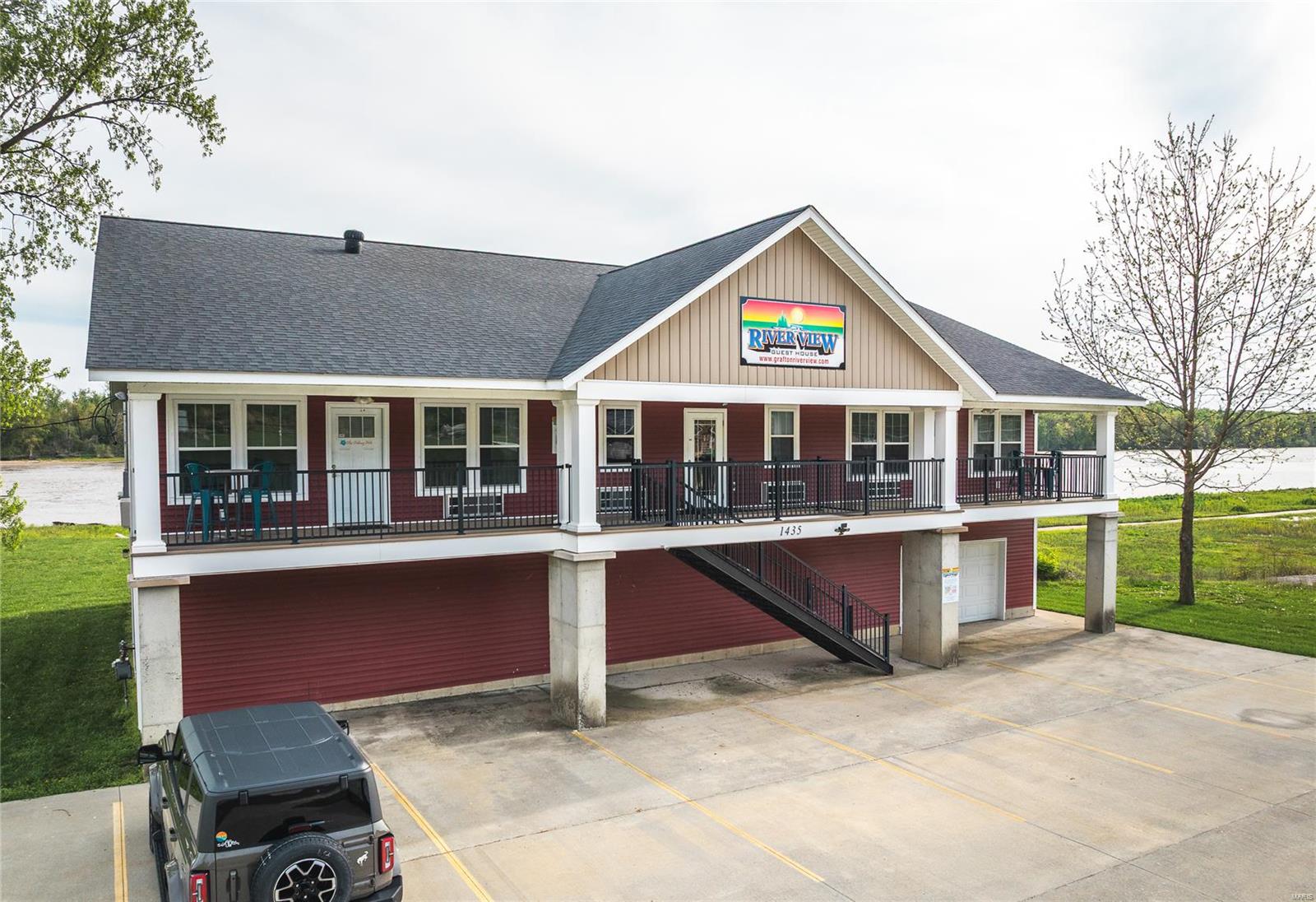 Fantastic investment opportunity in this 6 unit nightly rental located in the quaint river town of Grafton, IL. This well designed riverfront property offers breathtaking views from every suite, making it an unforgettable place to relax and recharge. The large covered decks invite you to start your mornings with a peaceful sunrise and end your evenings with a stunning sunset. The level backyard offers a place for gathering with friends, featuring picnic tables, barbecue grills, and a fire pit—perfect for sharing stories under the stars. For those looking to stay active, easy access to the nearby bike path makes it simple to enjoy a scenic ride along the riverfront. Don't miss your chance at this unique investment opportunity. Location: City