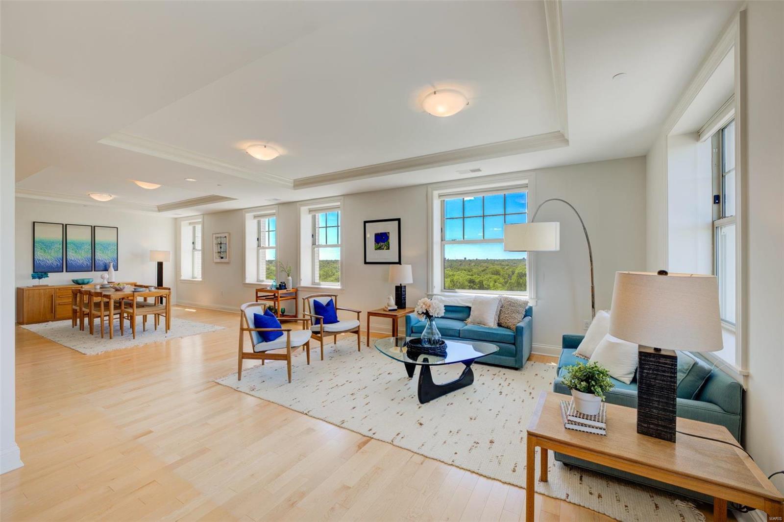 Absolutely stunning condo with incredible views of Forest Park, recently voted the #1 city park in the US!2 beds, 2.5 baths & 2124sqft of living space.Greet guests in large entry foyer w/circular coffered ceiling & dual closets.Maple hardwood floors, coffered ceilings & recessed lighting throughout living/dining room & den which features a double-sided gas fireplace & privacy sliders. Updated kitchen w/maple floors/cabinets, Thermador appliances, stainless hood, Sharp drawer microwave, 5-burner gas range, Kitchen Aid refuse compactor, custom backsplash, under-cabinet lighting, granite counters & large built-in pantry.Owners suite w/new carpet, coffered ceiling, custom walk-in closet, raised vanity, linen closet, heated floors, walk-in shower & jetted tub.Private second bedroom ensuite includes new carpet, custom closet, updated full bathroom(heated floor)w/walk-in shower.In-unit laundry w/Bosch washer/dryer & powder room.Secure garage spots(2).Excellent walkability in the heart of CWE! Location: City, Corner Location, End Unit