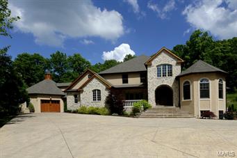 You won't want to miss this custom built 1.5 story private gated estate on 4.68 acre lot with gorgeous in-ground pool, waterfall and lush landscaping. Attention to detail throughout. Gracious foyer with walnut floors. A private study and large dining room. Two story great room with lots of windows and a stunning fireplace. The kitchen is the heart of the home with granite countertops, gas cooktop and built-in refrigerator. Adjoining the kitchen is a breakfast room and hearth room with stone fireplace and gas logs! Main floor master suite with sitting area and luxury bath. Three additional upper level bedrooms each with a private bath and study area. Finished walk out lower level, rec room, media room, bedroom, one full and one half bath! Seven car garage and more!!!