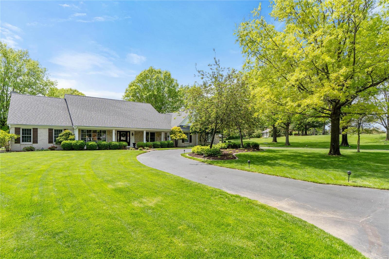 Welcome to 248 Herworth, an exceptional residence nestled within the desirable Forest Hills Country Club. This home sits on an acre and backs directly onto the scenic golf course, blending luxury living with serene views. The expansive 5-bedroom, 3.5-bath layout offers ample space and comfort, with a stunning great room featuring a vaulted ceiling and a striking stone fireplace. The custom chef's kitchen is a culinary masterpiece, equipped with high-end appliances, a gas range, and elegant custom cabinetry, perfect for both everyday cooking and grand entertaining. Step outside onto the spacious deck to enjoy the lush surroundings and views of the rolling greens. The finished walkout basement is designed for entertainment, featuring a full bar and plenty of room to relax. Whether you're hosting guests or unwinding after a round of golf, this home offers the ultimate country club lifestyle with its refined details and exceptional location. Experience the finest of Forest Hills living.