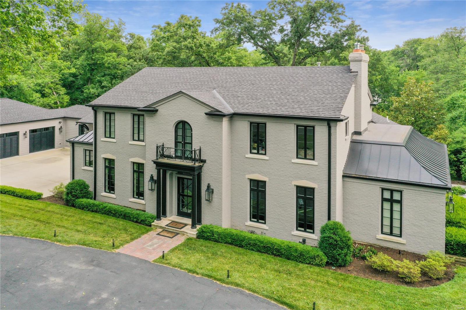 Tucked away in the prestigious Ladue School District, this exquisitely renovated home offers a seamless blend of modern luxury and inviting warmth. A complete gut renovation and thoughtful addition have transformed this property into a 5000 sq ft, 4 bd. 4 full and 3 half bath home. The heart of the home is the open-concept custom kitchen and family room designed with sleek lines and high-end finishes.  A custom bar, formal living and dining rms create ideal spaces for both entertaining and everyday living.  The main floor master suite is a serene retreat, featuring a spa-like bathroom and large dressing room. A custom mudrm and laundry complete the first floor.  Upstairs, three additional bedroom suites provide privacy and comfort for family and guests.  Find a lg rec rm with look out windows in the walk out lower level.  Outside, the meticulously landscaped grounds boast a sparkling pool and charming pool shed with bath and changing areas, promising endless summer enjoyment. Additional Rooms: Mud Room