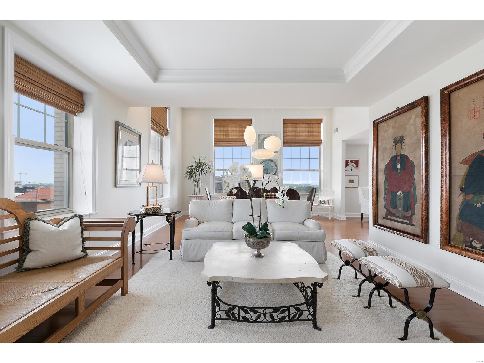FIRST TIME TO HIT THE MARKET! RARE CORNER CONDO ON 15TH FLOOR WITH 2-STORY WINDOWS & WRAP-AROUND VIEWS~FROM EAST TO SOUTH TO WEST~SUNRISE TO SUNSET IN THIS ELEGANT JEWEL-BOX OF A HOME! PERFECT FINISHES & A PENTHOUSE FEEL. NO COMPARABLE UNIT HAS BEEN AVAILABLE TO DATE. From the moment you enter,this home is designed for entertaining, every square inch is planned for luxury living & perfectly maintained.Soaring ceilings,built-in bookshelves,gas fireplace & butler’s pantry.Kitchen features Thermador Appliances & Luna Pearl countertops.Primary bdrm has brand new carpet.The 2nd bdrm is complete w/2 story windows and breathtaking views of Forest Park,the new “One Hundred” building & downtown Clayton.The doorman greets your guests.Walk out your door & find yourself in the heart of the CWE for dining & shopping.Amenities:concierge services,2 garage parking spaces,great storage,heated pool, private outdoor entertaining terrace,indoor entertaining spaces,3 restaurants & theater.By appt only Location: City