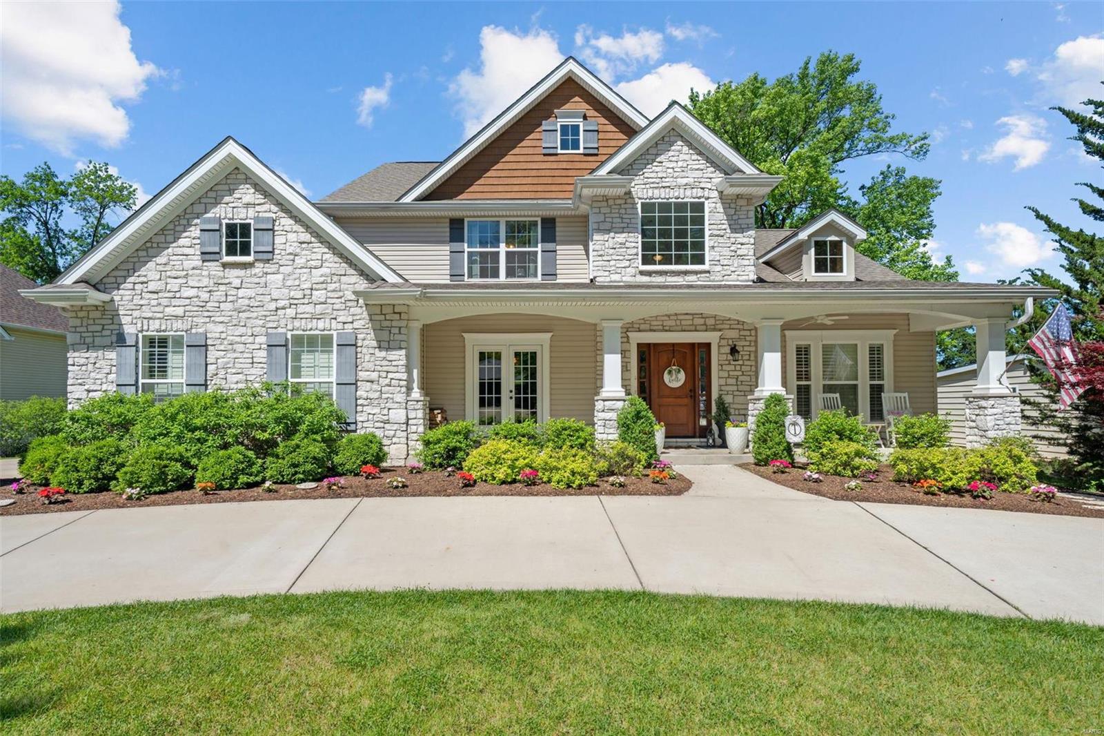 Exceptional 8 year old 1.5 story home in prime Des Peres location. The beautiful landscaping & impressive circle drive are the perfect backdrop for this gracious home, with its distinctive stone elevation & broad covered porch. Warm & welcoming, yet elegant, with high-end finishes incl. beautiful box beam ceiling, floor-to-ceiling windows & stone FP in great room. Fabulous kitchen w/custom off-white cabinetry, granite counters & SS appl., WI pantry & large center island. Opens to brkkfst/hearth room w/stone FP & French doors out to amazing covered porch & outside gas FP. Main floor primary suite: coffered ceiling, WI closet & gorgeous luxury bath w/tub, shower, double vanity w/granite counters & vaulted ceiling w/chandelier. Upstairs: 3 very spacious beds & 2 full bths. LL, finished in 2018, has large family room w/built-ins, office, gym, 5th bdrm & 4th full bath. The level, private backyard is perfect for a pool or a baseball game! Showings begin 6/21 at 3pm. Additional Rooms: Mud Room