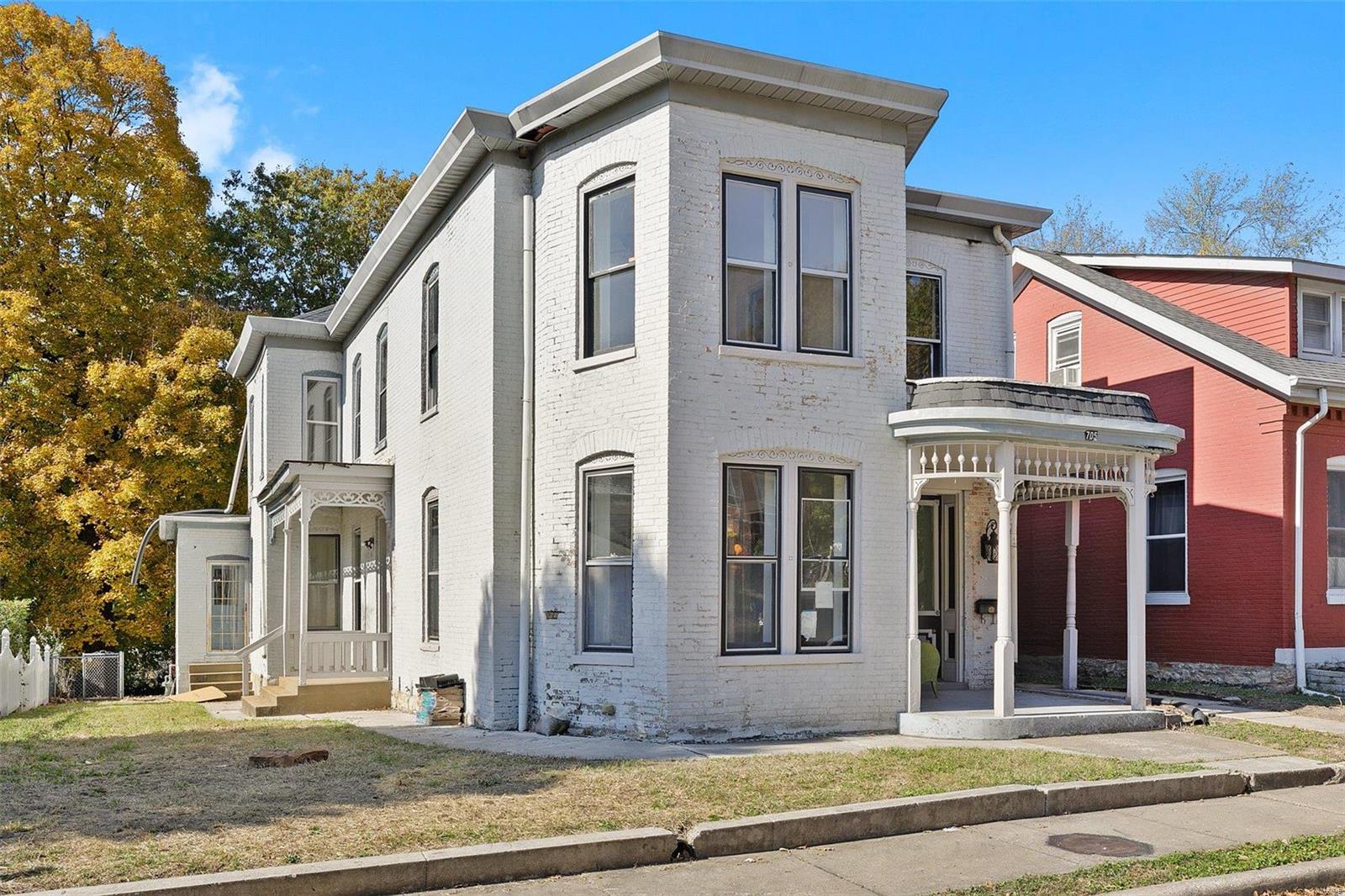 Bring your ideas to this 5 bed, 2.5 bath historic home full of 19th Century charm. A brand new roof, covered porch and a beautiful front door compliment this all brick 2-story and add unique architectural detail. Pocket doors, tall baseboards and soaring ceilings are already in place throughout the flowing floor plan. A wall of windows and a faux fireplace create a warm and welcoming atmosphere in the living room. Add your designer touches to the spacious kitchen and dining area. Turn the main level primary bedroom into your own private retreat.  Two guest rooms give everyone their own space. The upper level features a flexible floor plan with two gathering spaces perfect for a family room and living room.  Create a den, play room or possible sixth bedroom in the bonus room.  A private home office and two guest rooms complete this level. The fully fenced backyard is perfect for kids and pets and features a large patio and paver walk way.  Own a piece of history with this unique home!