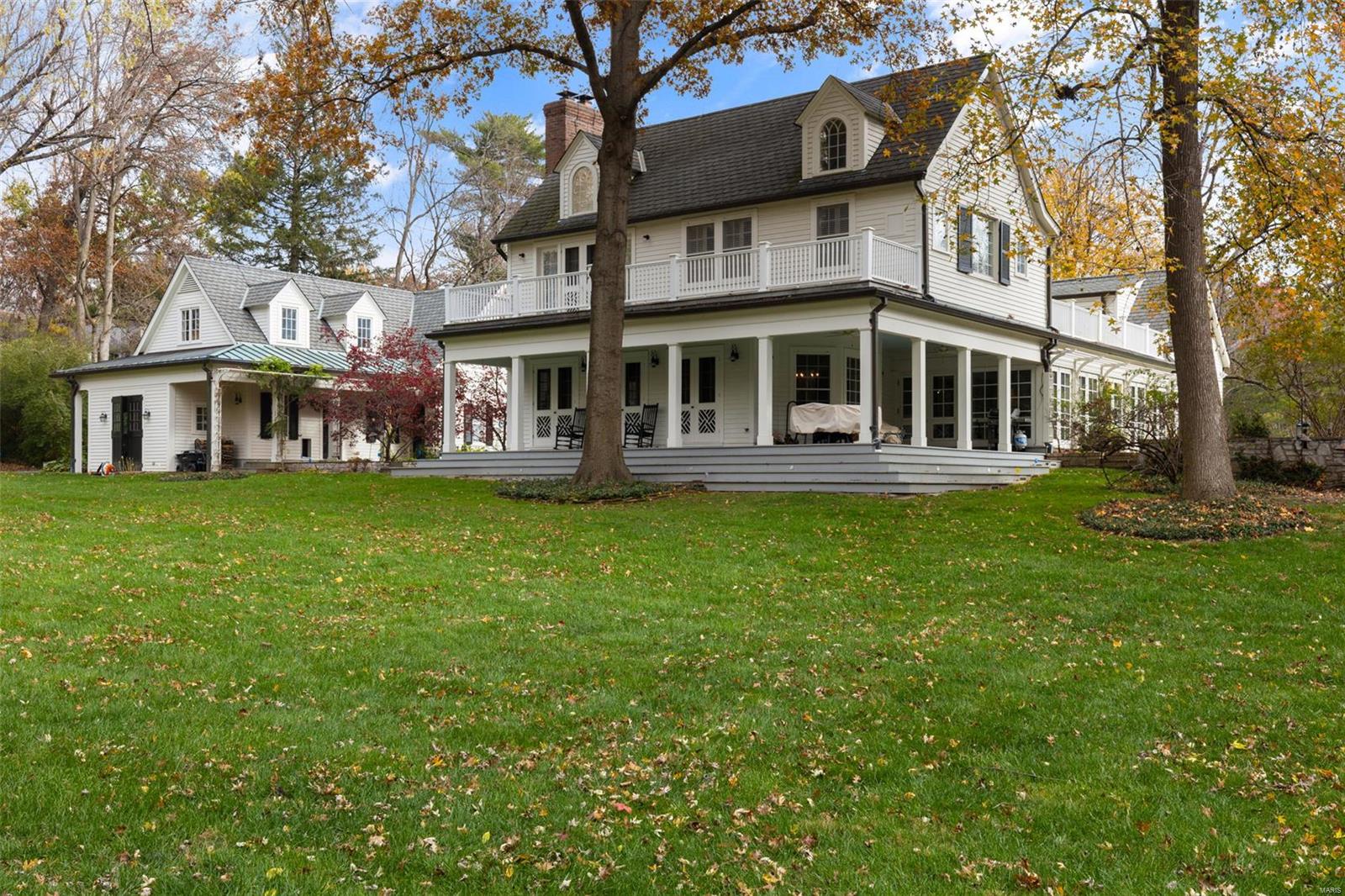 Nestled in the heart of Ladue, this breathtaking estate sits on nearly 3 acres of private, wooded grounds. Originally a 1910 farmhouse, the home has been Extensively Renovated & Expanded w most Newer construction—yet well thought out for Today's Lifestyle. Rich architectural details thruout. The Spacious living rm & dining rms open to All Season Heated Porch w/ frpl. The Kitchen & Hearth room are ideal for living & entertaining w/ multiple doors to charming back porch overlooking lot.2 main flr offices or den for more living spaces. The Primary suite offers vaulted ceilings, a fireplace, French doors private balcony, a dressing room, & a lux en suite bath.3 add en suites on second flr.Hardwood floors, soaring ceilings, & fine finishes reflect craftsmanship rarely seen today. The property includes a stunning pool/full bath/potential kitchenette.Newer 3+ car garage includes add room for office, exercise rm or bedrm w/ half bath. Above garage is large attic that could easily be finished.