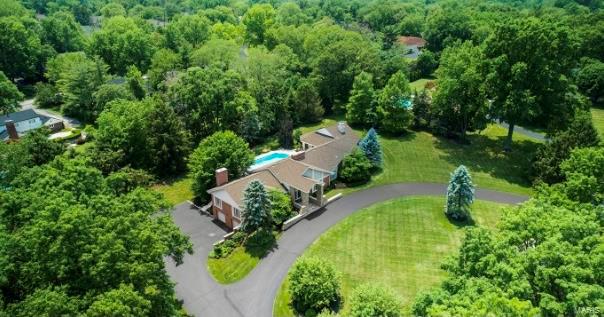 Coming Soon...showings will begin Friday, 4/23 at noon. No showings before. Spectacular one level transitional floor plan that everyone is looking for...sitting on over 1.7 acres with heated pebble tec pool and Kool Deck patio, this is truly an outdoor oasis.  Newly added master wing with French doors walking out to the covered loggia and pool bath)....picture perfect.  Enter into the foyer flanked by the dining room to your left with direct access to step down family room/office/entertainment area with stone fireplace, wet bar, soaring ceilings and a wall of windows.  To the right of the foyer, there is a double entertaining space with living room and great room right off the gourmet eat-in kitchen.  Gorgeous master bath with top of the line luxuries, walk-in closet and vaulted ceiling.  Three additional bedrooms (away from master) and two more full baths, plus laundry room.  The lower level is also finished with bar, mini fridge and great extra space. Sought after Frontenac location!