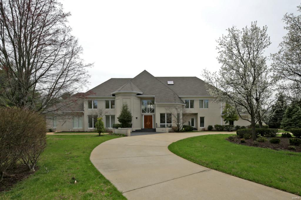 Back on mkt to no fault of seller.Buyer couldn't get financing.Spectacular cstm-blt contemp 1.5sty home unlike any other in STL.Truly once in a lifetime opp for 1 lucky buyer.Superb craftmanship,quality+style define this home that boasts a never seen before flr plan laced w/blk African gran flrs,curved walls+massive 2sty ceilings resulting in liv space flooded w/bright,natural light sunrise to sunset w/stunning views from wndws.Exquisite+extensive cstm controlled recessed lighting adds ambiance+distinction.Home's open flr plan is an entertainer's dream!Grand 2sty foyer/LR w/towering wall of glass blocks,sweeping staircase leads up to cstm open-air upstairs balcony w/exquisite views+3 upstairs bdrms.Mstr bdrm wing is a separate retreat featuring gran bth, Jacuzzi, customized his/her dressing areas,cstm dressing mirror,walkin closet+separate office/den.MF also incl guest quarter w/full bth.MF bdrms w/entrances to outdoor patio/deck.Grtrm w/wetbar.Condensing unit A/C 5 Ton replaced 6/14.
