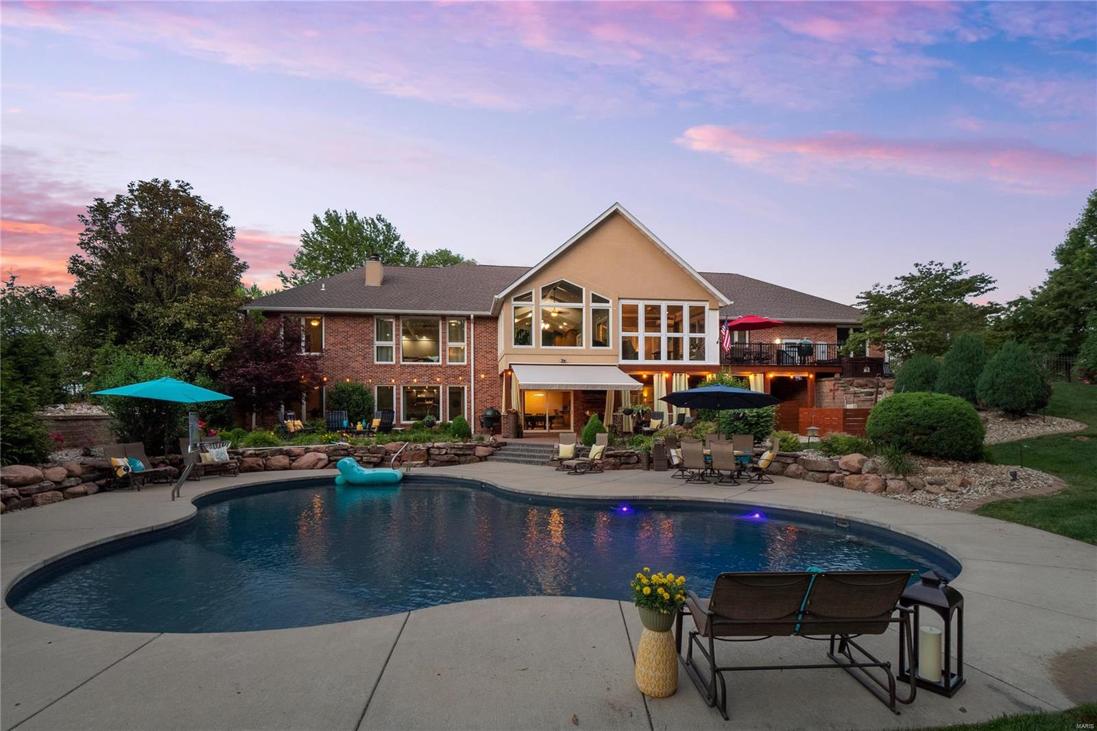 This absolutely STUNNING one owner ranch is over 6,000 sq ft, w/ 5 bedrooms & 4 full bathrooms. You will immediately notice the thoughtful design, high-end finishes, & upgrades throughout. Walking in your eyes are drawn to the gorgeous coffered ceiling & wall of windows overlooking the backyard. The living room also features custom built in shelving & a massive wood burning & gas fireplace. Enjoy cooking & entertaining in your eat-in kitchen, w/ granite countertops, a center island, breakfast bar, double sink w/ glass rinser, & custom pantry. Step into your very own spa, the primary ensuite bathroom is top of the line. From the steam shower w/ rain head, body jets and sound system, to the micro silk tub - for a full body facial. There's also a heated bidet, and custom walk-in closet. Turn key basement, everything you'll need for entertaining is included. Outdoors you’ll enjoy a heated, salt water pool, fire pit, hot tub, Sunbrella retractable awning, and no maintenance decking! Additional Rooms: Sun Room