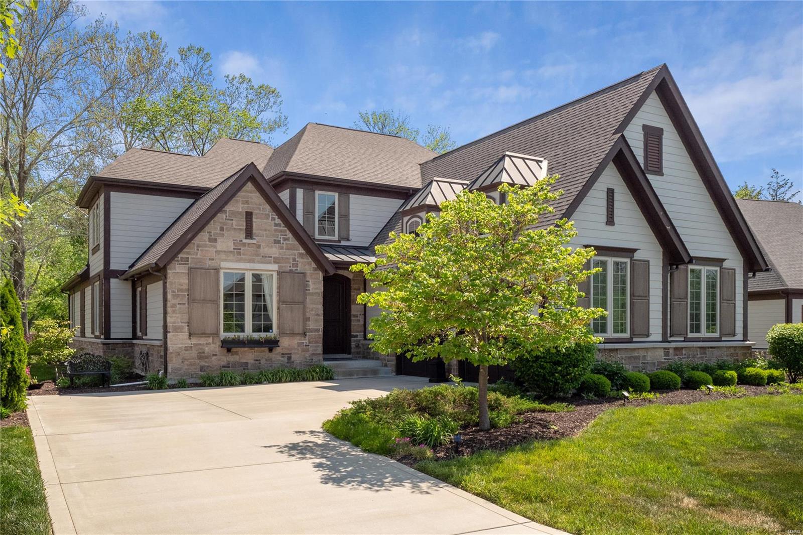 Rare opportunity for low-maintenance living in desirable Ladue location! This stunning home features an open floor plan w/ top of the line finishes & natural light throughout. The chef's kitchen features quartz countertops, walk-in pantry, Butlers Panty that leads to Dining Rm, large center island & breakfast nook; all opening to inviting 2-story Living Rm w/ fireplace. The expansive main flr primary suite features a luxurious bathrm ft. 2 walk-in closets, oversized shower, double sinks, & separate tub. A light-filled office, powder rm, & laundry rm complete the main floor. Upstairs you will find 2 BRs separated by a Jack & Jill bath along w/ a versatile bonus room. The LL boasts 1,500+SF of living space w/ a huge rec room, 4th BR, full bath, exercise room & ample storage. The home backs to common ground, providing beautiful park-like surroundings. The layout, incredible features, attached 2-car garage, along w/HOA perks like landscaping & snow removal make this home truly special.