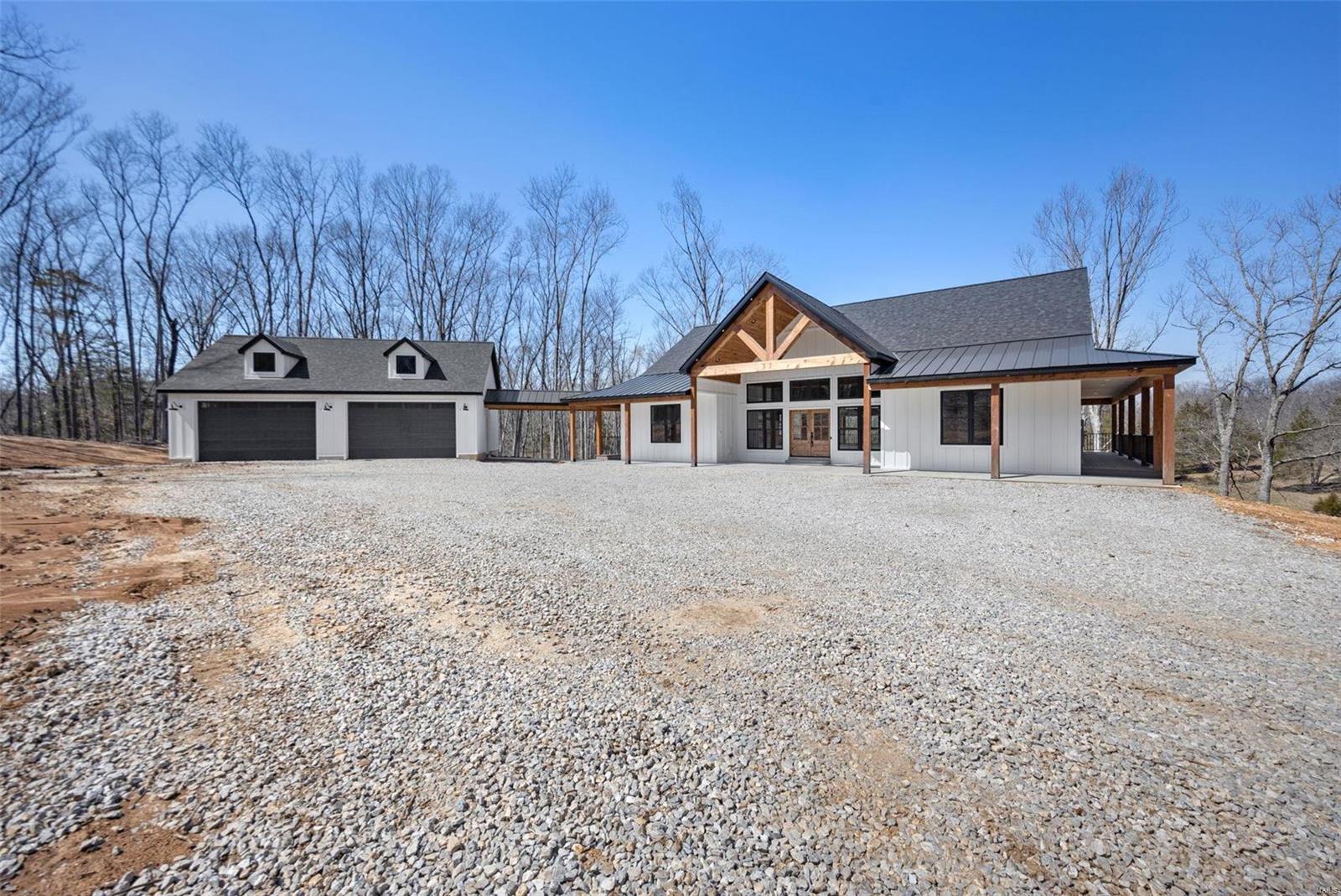 Welcome to your oasis nestled on 10 sprawling acres of pristine countryside. This custom-built 4-bedroom, 4-bathroom ranch offers a harmonious blend of luxury, comfort, and natural beauty. As you approach the property, a tree-lined driveway leads you to the charming facade with exposed cedar beams and a welcoming wrapped around porch. Step inside to discover an open-concept floor plan, where expansive windows invite abundant natural light and panoramic views. The heart of the home is the gourmet kitchen, featuring high-end appliances, granite countertops, and a center island perfect for culinary adventures and entertaining guests. Retreat to the spacious master suite with its spa-like ensuite bath. Each additional bedroom boasts an ensuite bath or jack and jill ensuring privacy and comfort for family and guests. With its unmatched combination of luxury living and natural splendor, this custom ranch estate offers a rare opportunity to embrace the quintessential country lifestyle. Additional Rooms: Mud Room