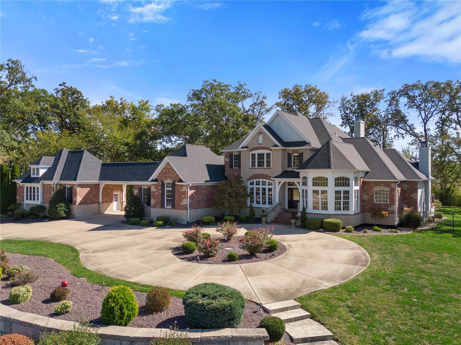 Extraordinary Executive Estate nestled on 10 secluded acres. You start your luxury tour as you enter through the gated entry, passing the 3 ac. Lake that provides home to the lighted fountain. As you approach the Magnificent 1.5 story home with over 6700 sq ft of finished living areas. Multiple entertaining spaces include a formal dining room. Breathtaking 2 story great room that admires a heated pool through palladian windows, and intimate hearth room with a stone fireplace. Gourmet kitchen offers a Butlers Pantry, island & granite counter tops. Amazing master suite has a fireplace w/ French Doors leading to a sunken hot tub on a private deck. Master bath feathures walk in shower,  separate tub, and custom walk in closet. The upper level host a Loft, 3 large bedrooms each with a walk in closet & bath. Amazing finished lower level w/ Granite Bar area, Media room, Workout Room, private 5th bedroom & full bath. Additional Rooms: Mud Room