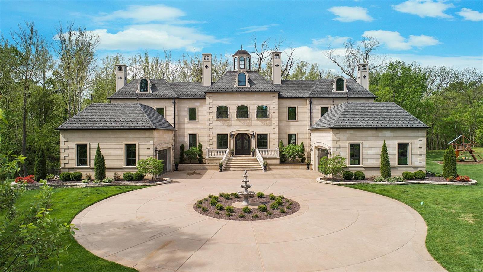 You can have it all! Majestic European Manse is the best of both worlds – plenty of room to roam, close to wine country, and yet just 15 minutes to Chesterfield Valley and 35 minutes to downtown Clayton! There is truly nothing else like it. From the rotunda tower, to the dual sweeping staircases, you will be in awe as you step through the front door. Custom built to the highest standards and no detail overlooked. Large kitchen/hearth room is the heart of the home, perfect to gather all your family and friends. The attached loggia will be your favorite spot to entertain on a warm evening, or curl up with a book. 1st floor master suite with impressive spa bath and walk-in closet, plus upstairs bedroom suites with direct access baths. 12ft walk out finished basement offers plenty of room for all your hobbies. When the summer heat hits, just take a dip in the bluestone pool. A truly liveable home with ‘his and hers’ garages, walk-in pantry, mudroom, butlers pantry and planning office. Additional Rooms: Mud Room