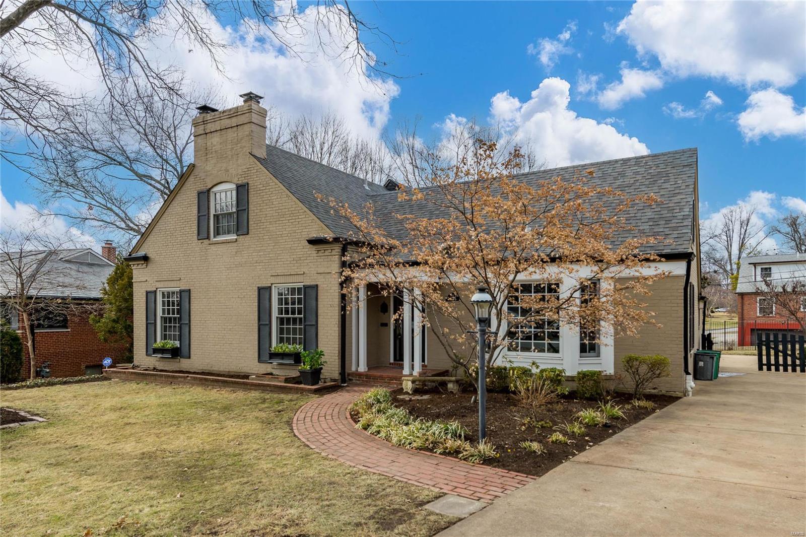 The beauty and walkability of this Clayton Gardens home are sure to impress! Stroll to Shaw Park, the library, restaurants & more. Fresh paint and new carpet throughout! The large & luxurious main-floor primary bedroom suite features a soaking tub, separate shower, heated floors, dual vanities, large walk-in closet & a private door to the deck. The home has a formal living room with a fireplace & a dining room with a bay window. High ceilings & oak floors throughout the main level. The masterfully done addition provides a large two-story family room with a gas fireplace & a wall of windows. The kitchen opens to the family room and has granite counters, a center island, gas range & warming drawer. Upstairs are 3 bedrooms, 2 full baths & a balcony overlooking the family room. The outdoor living space is perfect with a large deck & fully fenced yard. Expansive lower level with full bathroom, tons of finished recreation space, & plenty of storage. Attached rear entry garage.