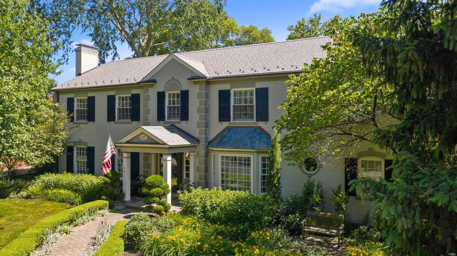 This impressive 5 bedroom home in the Lake Forest neighborhood is just a few minutes walk from downtown Clayton and in the Clayton School district.  The main level boasts a large updated kitchen opening up to the family room that looks over the serene Pebble pool. Separate living and dining room areas provide generous space for entertaining. Hardwood floors carry you throughout the main level. The upper level consists of 5 bedrooms and 3 full baths. The elegant master suite includes an updated bathroom and a spacious walk-in closet. The laundry room is conveniently located on the second floor. Updated systems throughout. Desirable features include new windows, new pool, professionally landscaped, & 3 car attached garage. Partially finished lower level.