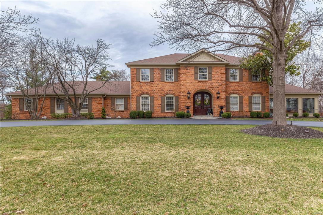 Stately brick 2-Sty in premier location! Custom-built home distinguished by exceptional craftsmanship & designer inspired renovations throughout! Gracious hardwood foyer leads to elegant dining room, family room with wide bay window, fireplace & built-in bookcases & formal living room with marble fireplace & atrium doors to step-down sunroom with coffered ceiling & 3 walls of windows. Spacious open kitchen featuring custom maple cabinetry, Corian countertops, premium appliances, granite center island & butler’s pantry adjoins breakfast room with tray ceiling & built-in sideboard and vaulted solarium. Sumptuous master bedroom suite with entertainment center, fireplace & lavish master bath offers a relaxing retreat. 3 Large additional bedrooms & hall full bath complete the 2nd floor living quarters. Professionally finished Lower Level with huge recreation room, game room & full bath. Impeccable 1+ ac grounds include patio, pool, pool house, fireplace, circular drive & 3-car garage. Additional Rooms: Sun Room
