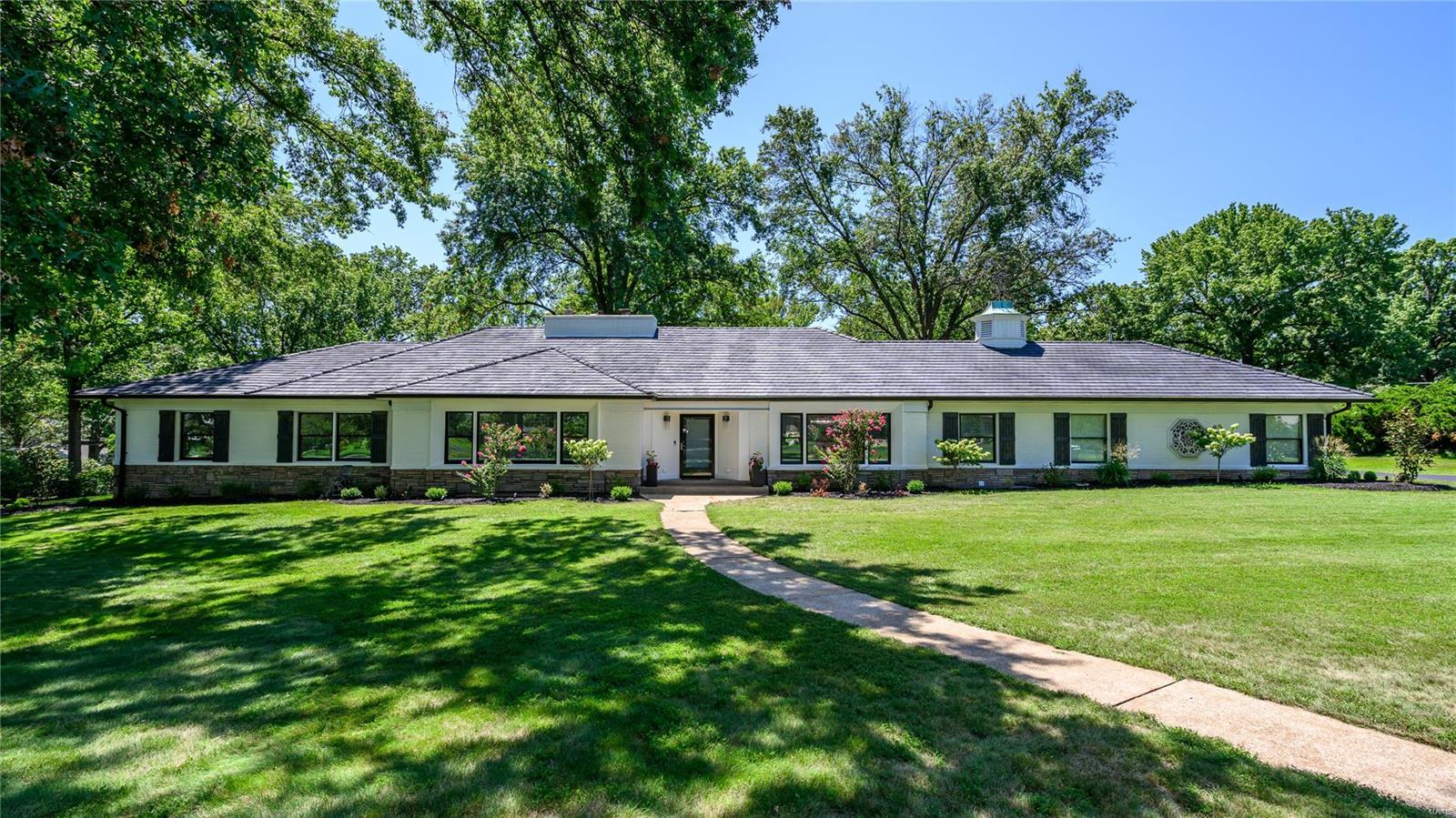 This Executive, Expansive Ranch sits handsomely on a tree-lined Lane in desirable Town & Country! Renovated, this sprawling 5,400+ sq ft Home offers polished Sophistication on a spacious 1.1 Acre Lot, in a small Gated Enclave! Graceful, large rooms provide entertaining spaces that flow seamlessly with New Red Oak Hardwood floors thru-out Main Level! From the Grt Rm a large Window Wall overlooks the 36X14 Four Season Rm .. enjoy Out-Door Living all year for morning Coffee or evening Sunsets! The spectacular Kitchen enjoys New Cabinetry, Granite, Huge Center Island, New Stainless Appls and open to the Grt Rm for “Heart-of-the-Home” Living! In the Lovely Bedroom Suite is an Ensuite Bath, Custom Walk-in Closet plus His/Hers Closets! The finished Lower Level gives additional Living w/ a Kitchenette/Liv Rm, W/D, Media Rm, Rec Rm w/ Wet Bar, huge Full Bath & 2 Bonus Rms for Sleeping, Office, etc! Rear Entry 3 Car Garage! Ideal location! Just minutes to Hospitals and Hwy(s) 40 and 270! Additional Rooms: Sun Room
