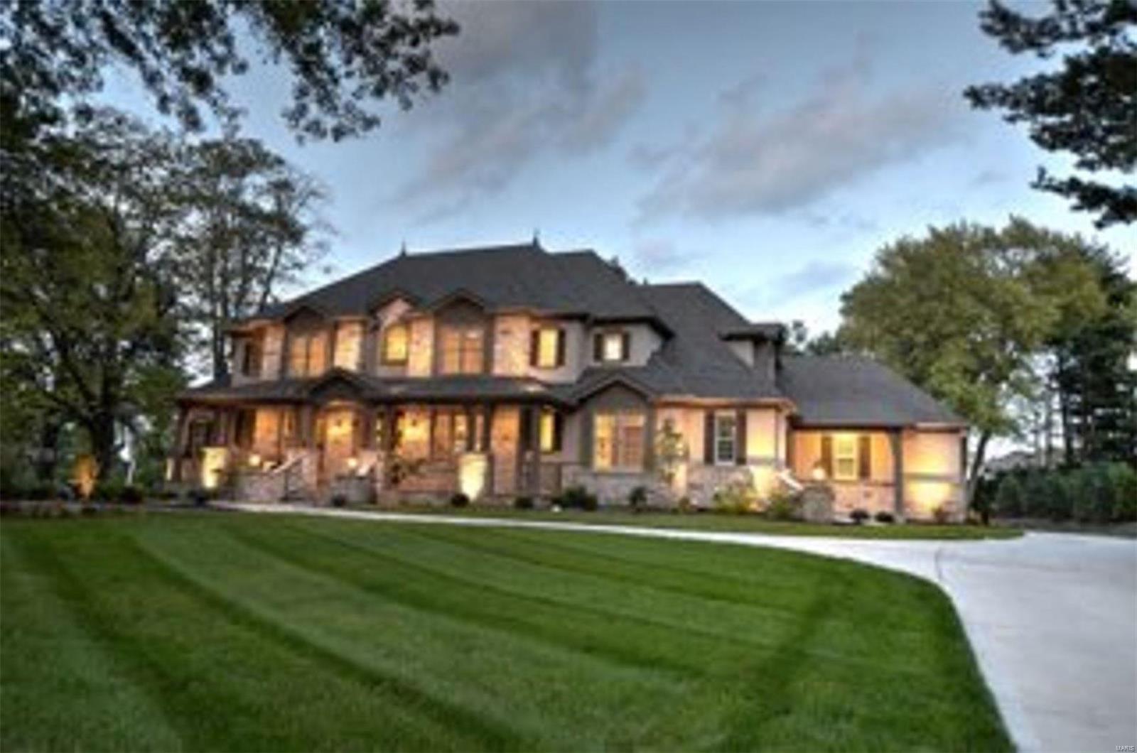 Gorgeous, custom-built, 5 years new, 1.5 story in Town and Country.  Impressive stone home with a circle driveway & a stunning Baker pool. The foyer contains a private study and a gracious separate dining room. Straight ahead will be a vaulted hearth room and next to it a sunroom, both with a stone surround gas fireplace. The kitchen has state-of-the-art appliances, custom cabinets, granite countertops, a center island, and much more.  In addition to the luxurious master bedroom suite, there is also a 1st-floor guest suite. The 2nd floor has 3 bedrooms w/ en suites and a loft area. A finished walk-up in the lower level has a recreation room, wet bar, beautifully custom built wine cellar, fitness room, & full bath. State of the art lighting and music system, hardwood floors, custom cabinetry, 3 zoned HVAC, 4 car rear entry garage, granite tops, built-in cubbies, central vac, security system, professional landscaping, Baker built-in pool, motorized pergola, & an outdoor kitchen. Additional Rooms: Sun Room, Wine Cellar