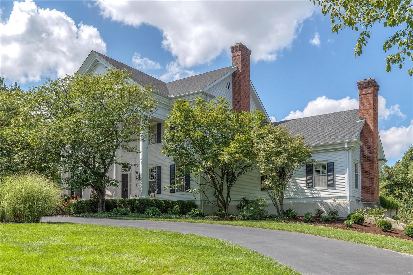 A truly magnificent Southern Colonial on 2.4-acre grounds! Grand entry foyer leads to private study with custom built-ins, sophisticated dining room & spectacular great room with entertainment center, floor-to-ceiling fireplace flanked by bookcases & bow window with French doors to terrace. Designer kitchen with natural cherry cabinetry, premium appliances & brick accent wall with wood stove adjoins breakfast room with wide bow window. The master bedroom suite combines the enjoyment of a marble fireplace with lavish bath with shower spa & Jacuzzi & access to private porch. The 2nd floor extends the living quarters with 4 additional bedrooms, loft sitting area & 2 full baths. Lower Level features recreation room with see-through fireplace & gathering bar, family room, workout room & full bath. Outdoor entertaining area includes expansive brick terrace & pool surrounded by landscaped gardens. State-of-the-art amenities include SONOS sound system, Crestron security system & generator.