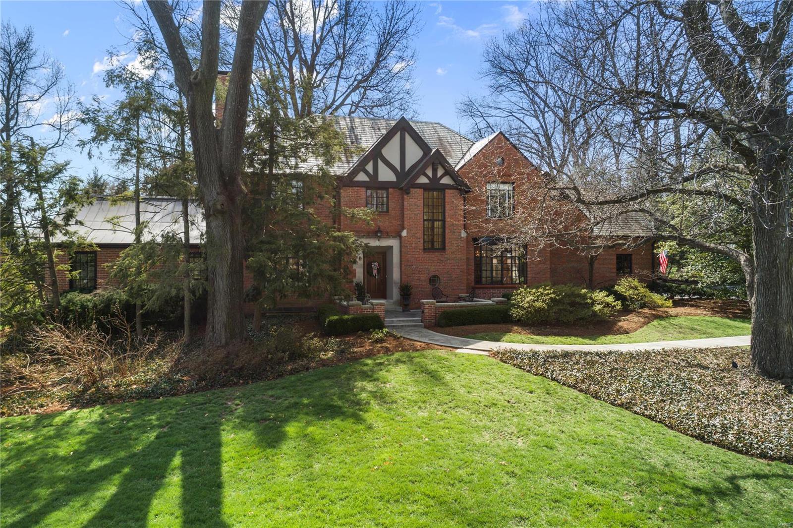 This exceptional Maritz and Young designed residence is sure to impress. From the moment you enter, you can't help but appreciate the remarkable architecture and graciousness of this home. The light filled living room has a large picture window and glass doors to an expansive patio featuring Eden limestone. The family room boasts a vaulted ceiling, palladian window and large stone fireplace. The formal dining room is perfect for entertaining. The updated eat in kitchen is a chefs' delight with Subzero, Dacor appliances, quartzite countertops & center island. A cozy den completes the 1st floor. The inviting master BR has fabulous closet space and an updated bath with double sinks and separate tub & shower. Three additional bedrooms & two more updated baths complete the 2nd floor. The lower level has a living area with gas fireplace, an office area & a large laundry room & storage area. The 4th full bath is in the LL. The spectacular lot with exquisite landscaping is beyond gorgeous!