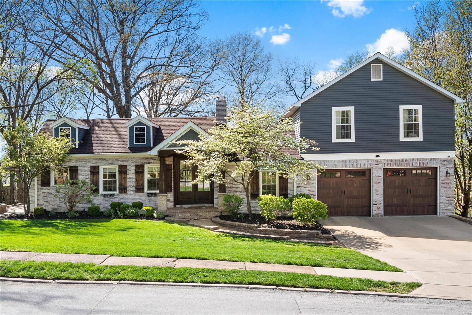 Elegance abounds in this stylish Kirkwood home. Brick/Stone exterior greet you on arrival.  Brick paver walkway leads to craftsman style Wood and Glass front door. Gleaming Wood floors throughout main floor.  Spacious home w/ over 3,440 sq ft on 1st 2 floors which has been seamlessly blended via 2018 addition and remodel project. High End Kitchen with cambria tops, stainless steel appliances including gas range, and brick tile backsplash. Spacious Main floor master suite with walk in closet.  Luxury Master bath w/ dual vanities & oversized glass encased shower with floor to ceiling tile.  4 beds upstairs for the kids.  Upstairs bath features dual vanities & double showers! Finished LL is great kid space or workout area. Watch the sunset and lounge in DREAM outdoor covered patio w/ gas fireplace and BBQ grill. Another masonry fire pit near large level backyard. Perfect for the kids! This Turnkey home w/ premium finishes near Kirkwood park is everything your family has been looking for!