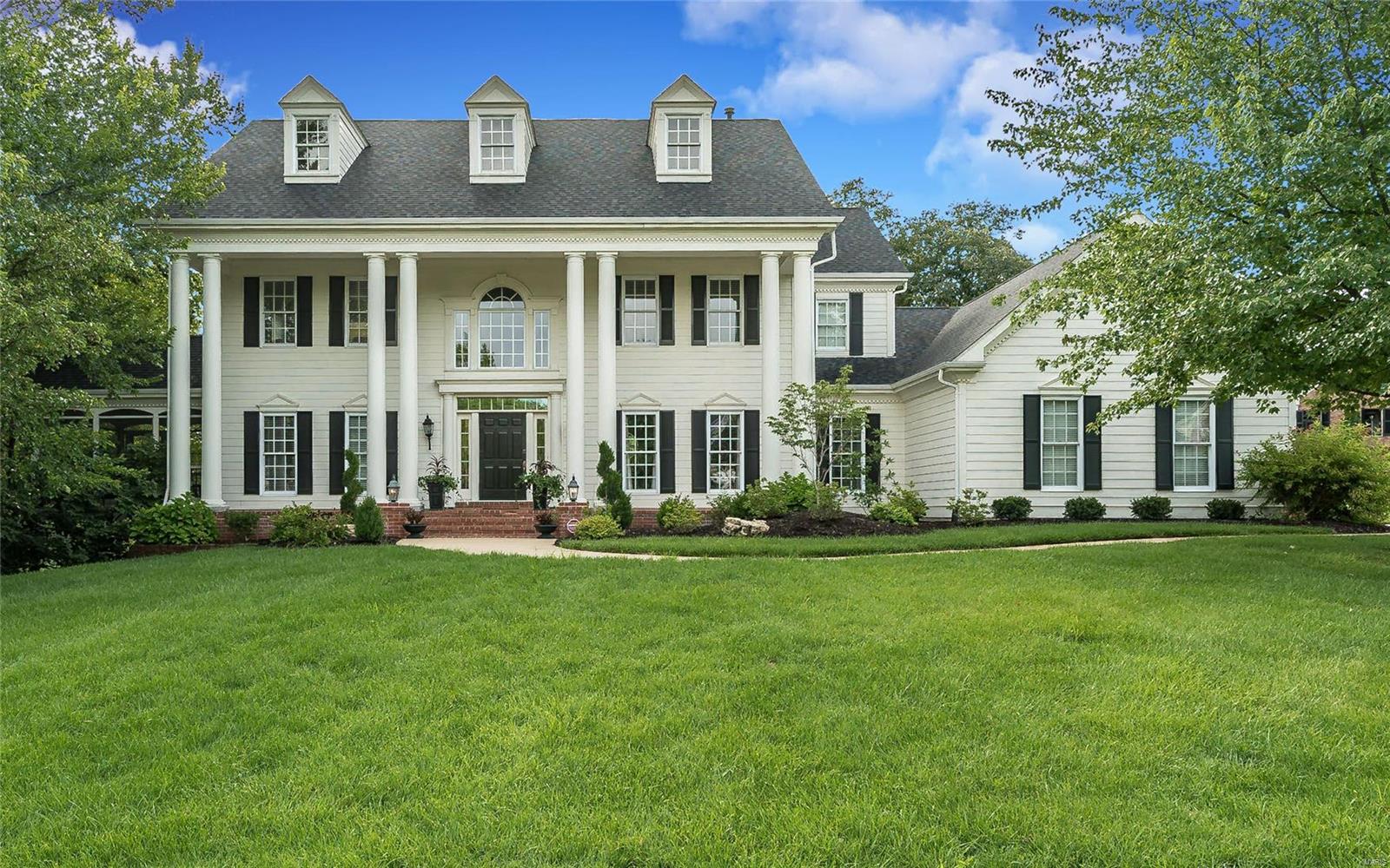 Magnificent Southern Colonial in premier gated neighborhood! Open floor plan beautifully designed & stylishly appointed to accommodate daily comfort & gracious entertaining. Grand 2-sty foyer leads to elegant DR w/ elaborate millwork, formal LR that opens to screened porch & spacious FR w/ wide bay window & brick fireplace flanked by built-in bookcases. Designer kitchen w/ 42” white cabinetry, quartz countertops, stainless steel appliances, 10’ center island & butler’s pantry adjoins hearth room highlighted by brick fireplace. Coffered MSTR bedroom ste w/ customized walk-in closet & luxury bath w/ jetted tub offers an appealing retreat. 3 Generous-sized additional bedrooms, 1 w/ ensuite bath & 2 w/ Jack n’ Jill bath, complete the 2nd floor living quarters. Walk-out LL includes recreation room w/ fireplace & bookcases, media room w/ wet bar, office & full bath. Situated on a premium cul-de-sac lot w/ deck, patio & 3-car garage. Swing set & all media room furniture & components included.