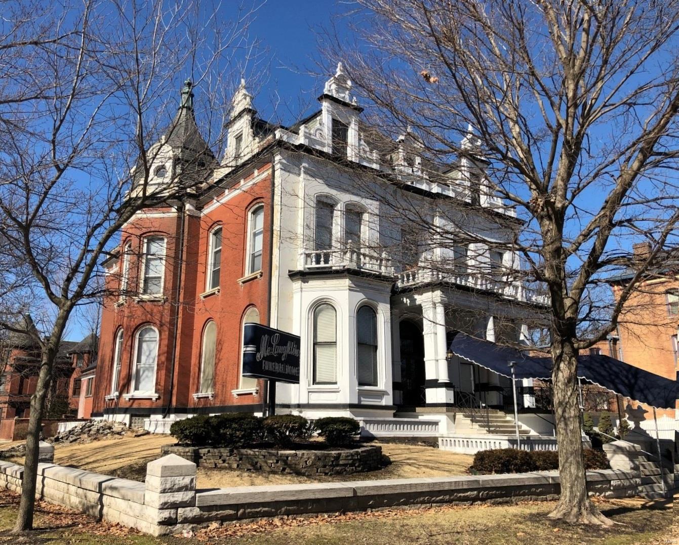 Spectacular opportunity to be a part of Lafayette Square with over 10,000 sf of living space and facing Lafayette Park. This home features a great deal of historically significant and interesting architectural features and charm that will leave you breathless. Victorian facade with large arched windows, ornate brick and stone work, exterior decking with large stone balusters and rails, slate roof, custom copper finials, perimeter dentil work, stone walls, custom iron fencing, large urn planters and beautifully painted front. Interior is equally impressive with handmade, custom woodwork throughout, 14 foot ceilings, historic crown molding and beams, art glass windows, wall murals, period lighting, Missouri mined marble vanity tops and wainscoting, beautifully carved staircase, handrails, spindles, and cornice work. Currently used as commercial space but could be converted into the most impressive home in the Square! Comes with oversized 3 car garage and carriage house with apartment. Suitable for Bed/Brk