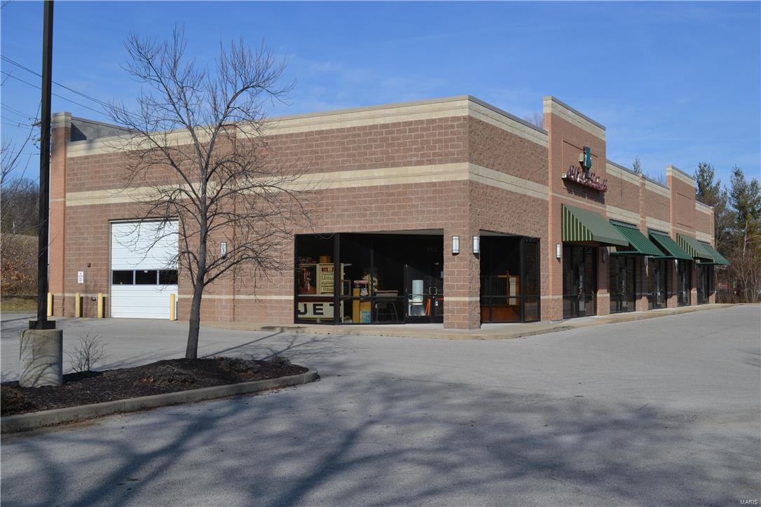 Major price reduction.  Owner says bring an offer.  High visibility, almost 10,000 SF retail/warehouse building easily seen from Hwy 30. Great access with signalized intersection at Hwy 141 and near the Gravois Bluffs center that draws from around SW St. Louis and northern Jefferson counties.  Newer construction, attractive architectural concrete block building with 14+ foot clear ceiling height; fully wet sprinklered.   There are two drive in doors, 12x12 and 14x14.  The building can be divided; windows, doors, electric and roughed-in plumbing set up to allow for three 23 x 80 and one 70 x 60 rental units. Sale only. Location: High Traffic, Hwy/Interstate Frntg, Retail Center, Suburban