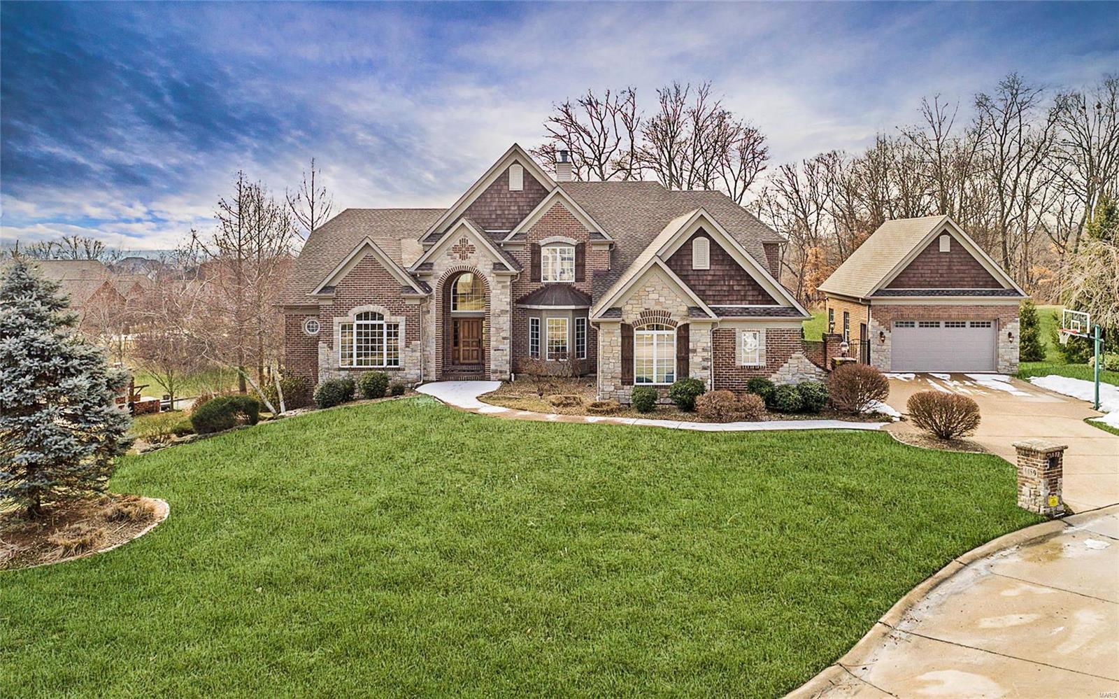 Your dream home awaits! This fabulous custom home is nestled on a private cul de sac offers year round entertaining inside & out. Attention to detail abounds in this 3/4 brick, 5 car masterpiece w/extensive millwork & unique ceilings. Incredible outdoor space w/every upgrade imaginable from the salt water pool & spa to the expansive outdoor kitchen & bar, you will entertain in style. Gather around the free standing fireplace & enjoy the gorgeous view into the common ground at the back of the lot. The chef kitchen boasts Viking refrigerator, 6 burner gas stove, double dishwasher, wine cooler & expansive granite counters. Cuddle up for a movie in the theater room while enjoying cocktails from the gorgeous LL wet bar or enjoy the expansive rec areas & 2 add’l bedrooms. Retire to an amazing master suite w/hydro-therapy tub, heated towel drawer & lush amenities. You will rest secure with the touch pad security system, while enjoying the music system, 3 zone HVAC, ensuite bedrooms & more!