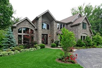This Ladue School District home has it all! Stunning 6 bedrooms/6 bath custom Berkley home located on a meticulously maintained lot, just under an acre. Impressive beveled glass door leads to a soaring 2-story foyer. Open floor plan has a spacious feel, sophisticated finishes and beautiful views in every direction. Formal dining room boasts vaulted, beamed ceiling, with a gourmet kitchen, complete with granite countertops, custom cabinets, Dacor appliances. The relaxing family room is the hub of the home, with vaulted ceiling, stone fireplace and breathtaking views of the grounds. Luxurious master suite includes fireplace and 2 huge walk-in closets. Upstairs, 4 bedrooms are bright and spacious. Finished lower level is made for entertaining, with full guest suite, large rec room with fireplace, bar, and kitchen, bonus room/office. Gorgeous private gardens surround the patio; wired generator and irrigation system. Also available for lease, MLS #15018692.