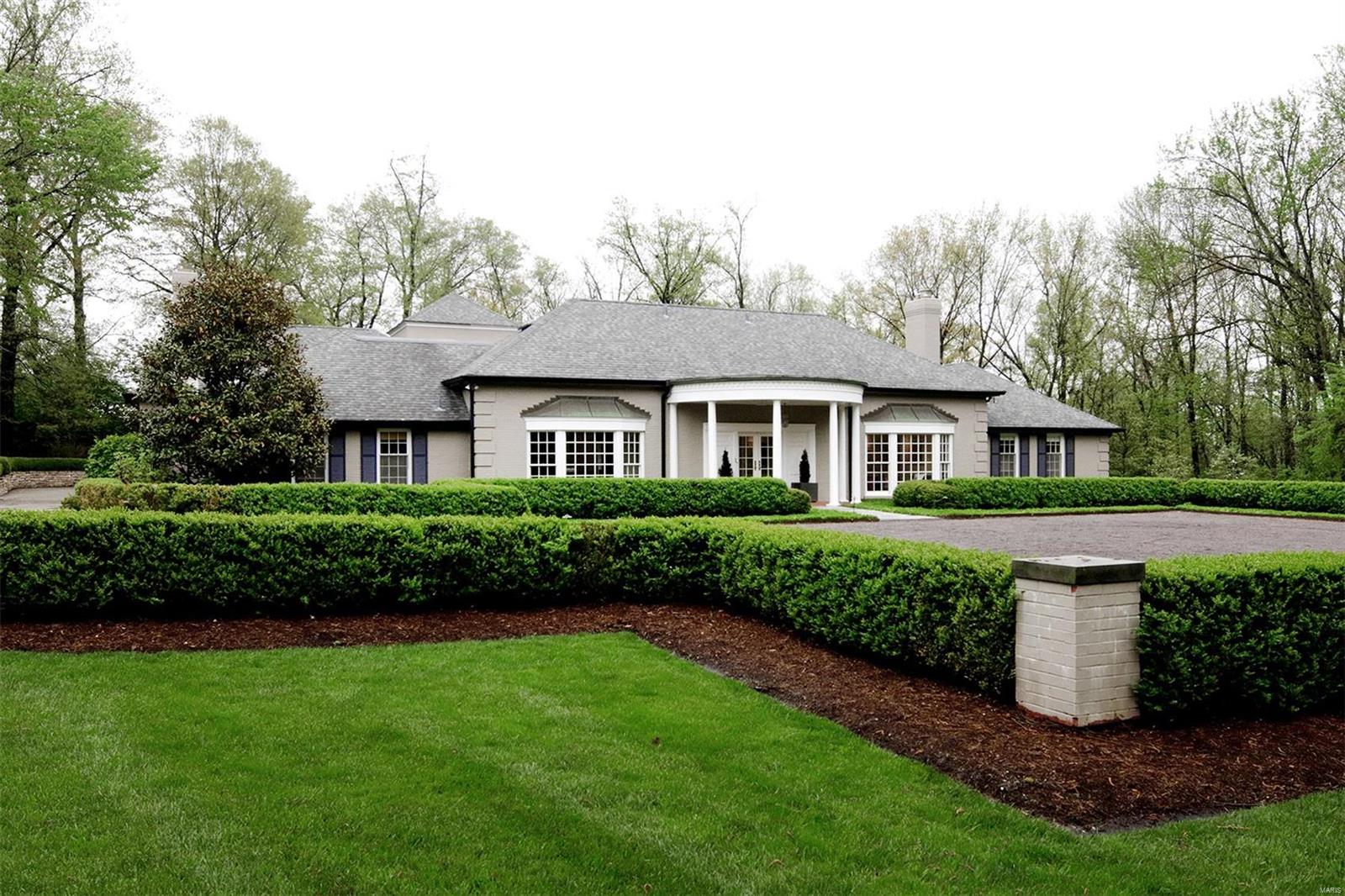 Unique one of a kind architecturally distinctive home built on a beautiful 1.8 ac. private lot in a convenient, walkable central location. Sleek and updated home is light and airy and built around a central garden courtyard. The welcoming front courtyard is just the beginning. Keeping in line with today's lifestyle, this home features a wonderful kitchen opening to a large family room and dining area. Both lead to pretty outdoor spaces. The first floor includes an extraordinary master suite with spa-like bath and generous walk-in closets, a second bedroom (currently being used as an office) and full bath, media room with built-in wine cellar, living and dining rooms, laundry, utility and mud rooms plus two half baths. Three more bedrooms are upstairs along with a second large family room and two full baths.Lower level space is perfect for an exercise room, storage or kid's play area. Attached 3-car garage and beautifully landscaped, level and private yard. A very special home! Additional Rooms: Wine Cellar
