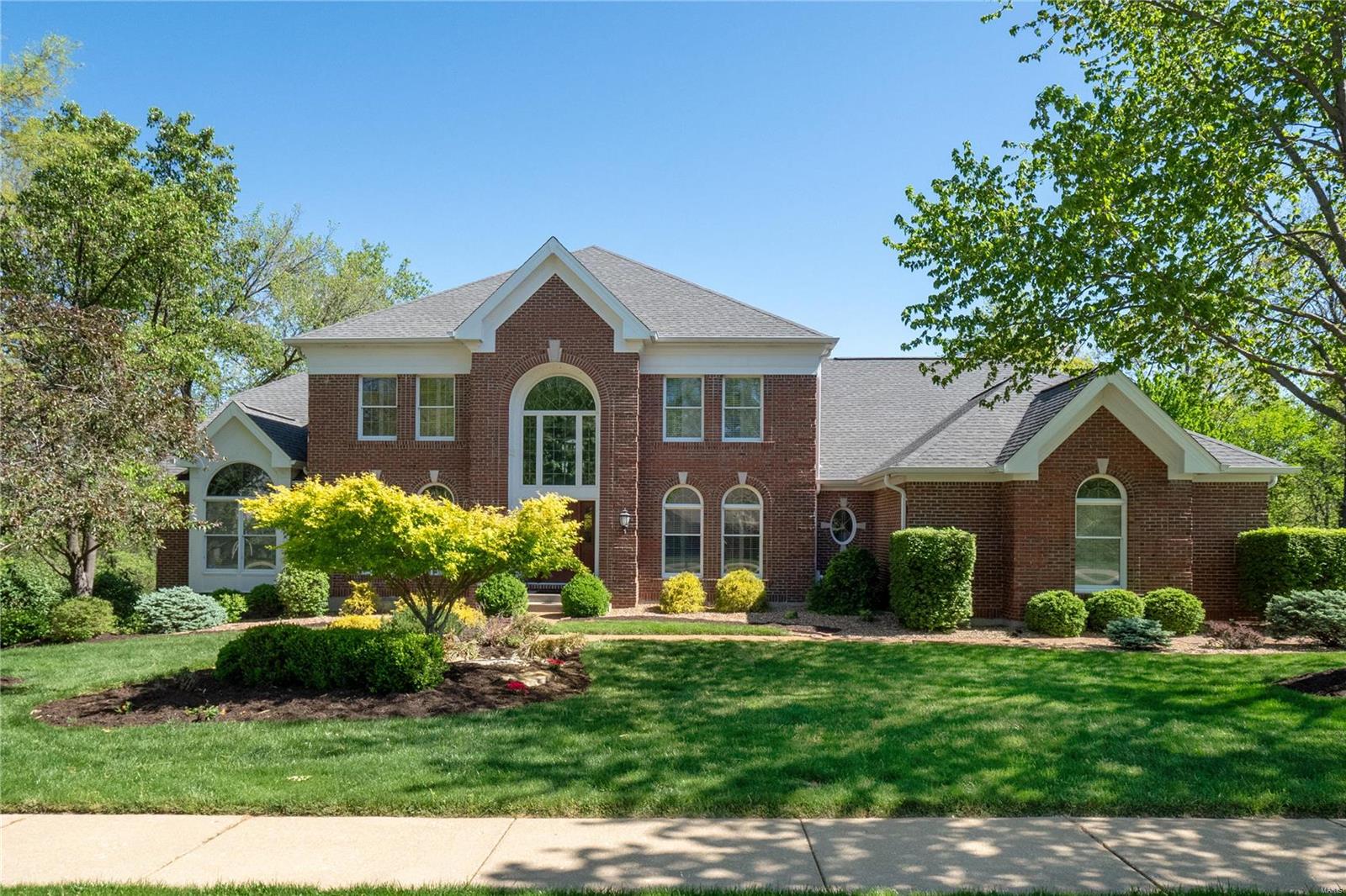 Stunning 1.5-story, 5-bed, 4.5-bath home in prestigious Wildhorse. Rare find with a flat yard, ideal for a pool. Upon entering you will be greeted by a grand foyer opening to a huge great room with views of a private backyard. Continuing through, notice the gorgeous new hickory floors throughout which flow into the chef's kitchen, featuring Viking appliances, custom cabinets, gas cooktop, granite countertops, and a walk-in pantry. Main floor vaulted primary suite with a huge bathroom, upstairs you will find a versatile loft, bedroom with a private full bath, and two additional bedrooms sharing a Jack & Jill bath. The LL features a wet bar, spacious rec room, workout area, and an in-law suite with a full bath. New composite deck, new garage doors/openers, exterior lighting, new doors, rear windows, and exterior siding, as well as 3 new 2-stage High Efficiency  HVAC systems with Dehumidifier/remote thermostats/fresh paint throughout. The community offers pools, tennis courts, and more.