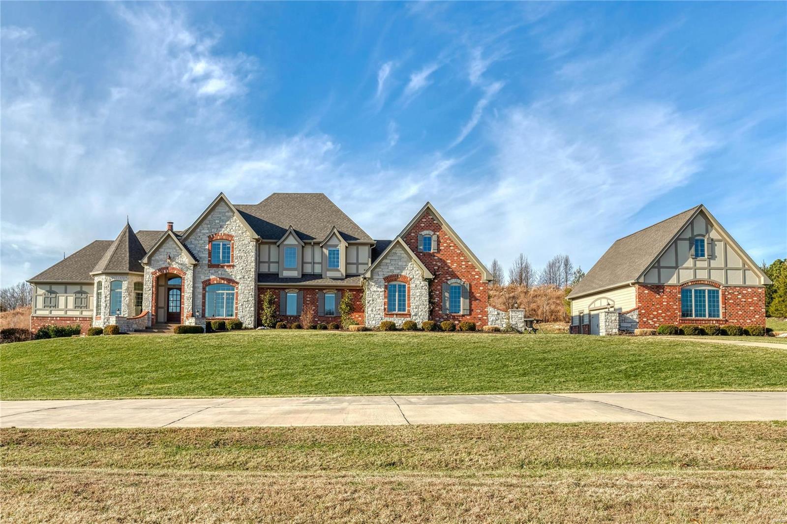 Like new Brick & Stone 1.5 story 7,400 sq ft Estate Home w/garage space for 7 cars. 3 acres in Wardenburg Farms on a street surrounded by multi-million dollar homes. Recently updated kitchen, baths and flooring! Kitchen w/ stacked cabs, Dacor dual fuel range,Bosch dishwasher & Carrera marble tops. White Shaker style cabinets & a 9’ black center island adjoins the brkfst & hearth rm w/ marble FP, beamed cathedral ceiling & bookcases. Sunroom overlooks the saltwater pool, patio & fire pit. Master bed w/ 11’ coffered ceiling, bathroom w/ soaking tub & oversized shower w/ body sprays. Elaborate millwork & job finished oak flooring. 12' ceilings in Foyer, Study & Great Room. Beautiful study. Great Room w/ marble FP w/ lighted bookcases, wall of windows & wet bar w/ beverage cooler. Second Office w/ 2 built in desks. 3 bedrooms suites on 2nd floor w/ 9’ ceilings & private baths and Bonus Room. Walkout LL w/ FP, rec room, wet bar, media room, full bath and office (5th bedroom). Additional Rooms: Sun Room