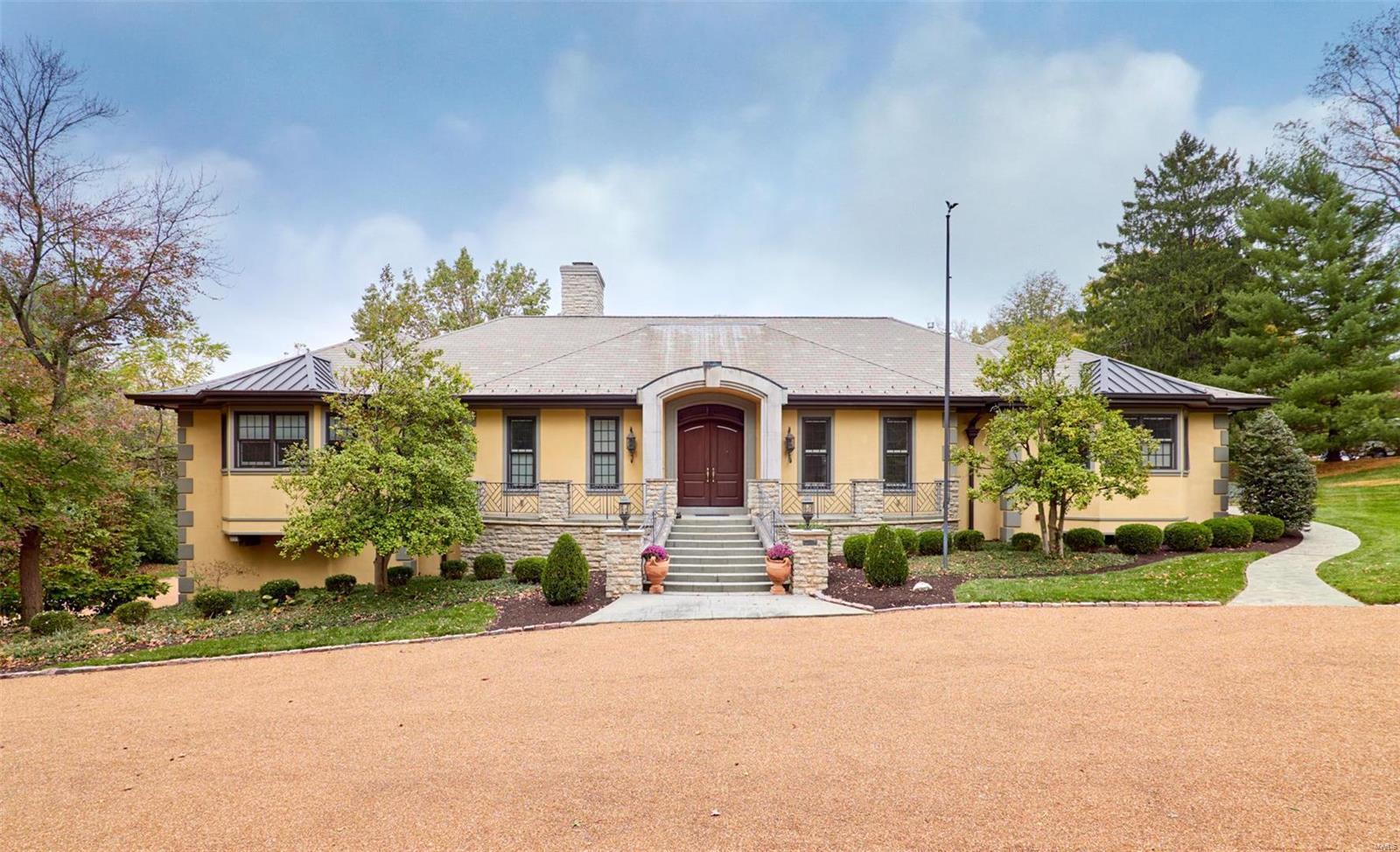 Gorgeous Ladue home on 2.33 acre lot, features a European flair w/open floor plan. Over 6,000 sq ft of fin. living space, 4 bedrms, 4 full & 2 half  baths, 3 fireplaces, 4 car oversize garage, inground pool w/pool house w/full kit. & ba. and greenhouse. Exquisite living rm shares see thru fireplace w/2nd sitting area and formal dining rm all open to the terrace overlooking the pool, the lush yard & gardens. Updated dream kitchen, 2 dishwashers, sinks & refrigerators, LaCornve stove w/5 burners, w/i pantry, wine cooler, ice maker, w/o to private terrace. Master suite w/3 walk-in closets, wall of organizer cabinets. Luxury bath w/multiple head steam shower, double vanities, w/o to terrace. LL features heated floors, 3 bedrooms each w/private ba, family rm w/wet bar & fireplace, w/o to covered patio. 3 zone HVAC/2 tankless water heaters/dedicated kitchen water heater/generator/central vac. MTec exterior, newer Pella windows, 75yr Lamarite roof, copper gutters, hot tub, heated sidewalk.