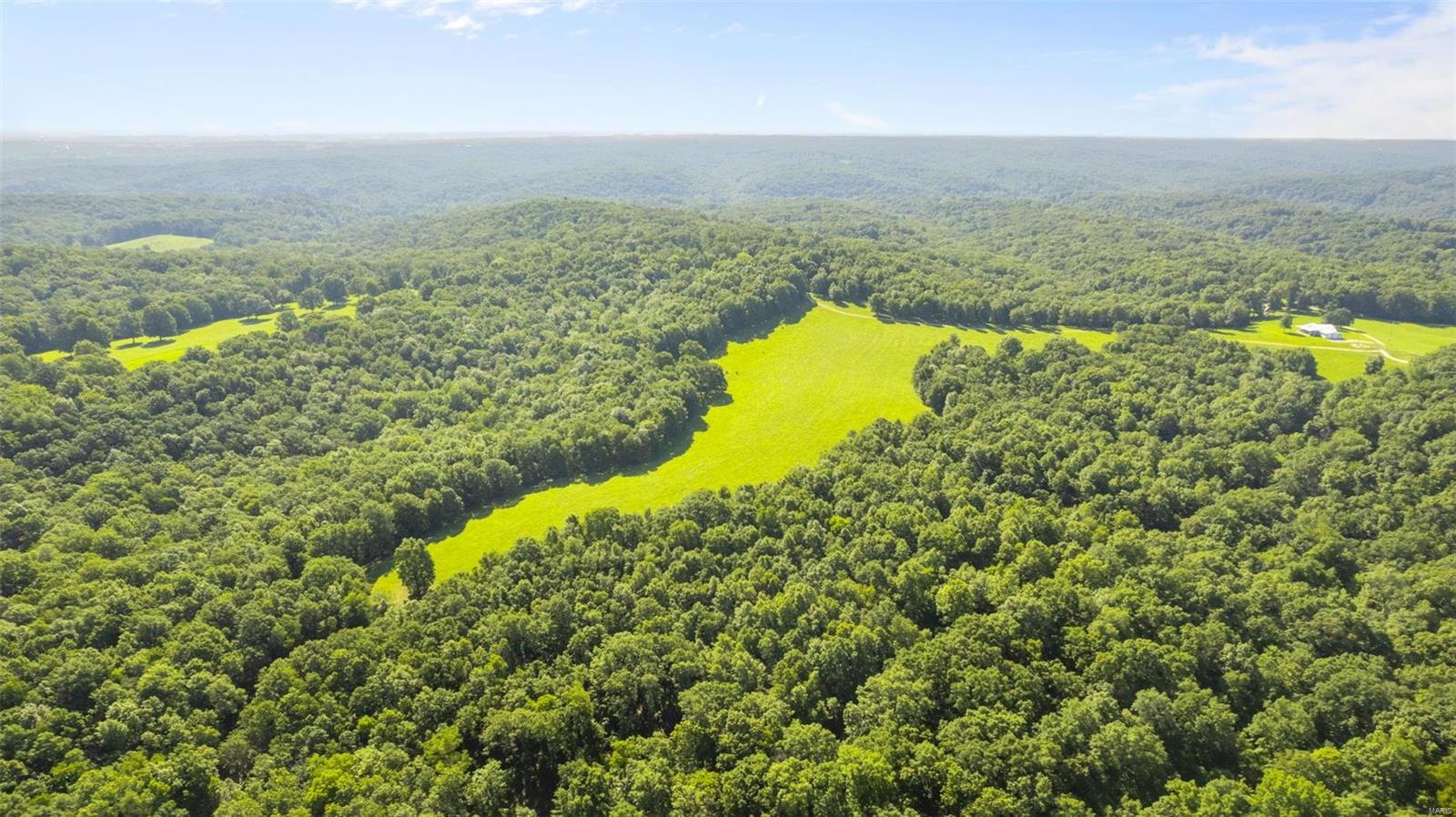 Looking for a property for hunting season, but can accommodate you beyond that..a lifestyle, a legacy; give this one serious consideration. Be one of the most prestigious landowners of Perry County by acquiring the largest tract of land for sale. You can escape to your own private, personal retreat, free from distractions and busyness of life. This sanctuary offers endless hunting, serene privacy, and the possibility of starting your own homestead. Want to get your start at a cattle operation? You can live on the ranch too. With access roads and trails, recreation options are abundant-hike, camp, hunt, horseback or ATV ride. Dry weather creeks, pond, and spring are water sources to attract wildlife or for play. Food plots and hickory grove are ready for hunting season. Majority of property is fenced. Residence was built in 2019. Live and play full time or rest and get away to a second home. Airbnb or event center is an option; weddings would be absolutely stunning. Duplicate #23046236