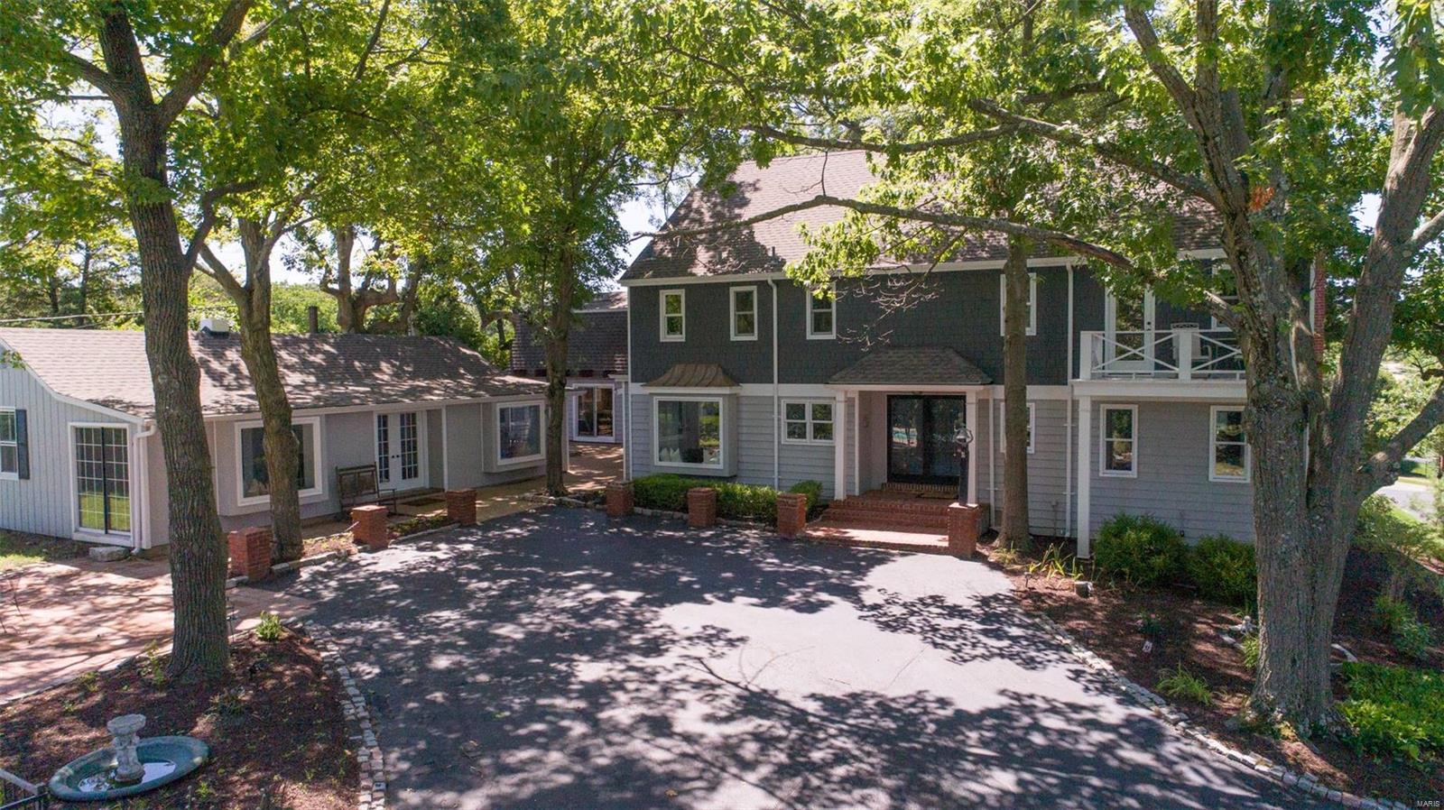 Stunning Wildwood estate has it all! Historic, w/charm galore, encasing a beautiful 19th Cent. log cabin, yet ‘HGTV-ready’, post recent remodel. Palatial 2stry GR features 17.5ft stone floor-ceiling FP, handscraped maple wood flrs & an elegant staircase. Remodeled ktchn incl new stainless app, large granite island with bkfst bar & picture wndw overlooking inground pool. Master br suite boast a 4-head marble-accented walkin shower, soaking tub, stone wndw casings & private deck. Entertain for hours in the 2stry, cedar-enclosed, 3season rm w/stone FP or the adjoining large courtyard. Separate 2bdrm remodeled guesthouse perfect for inlaw suite, home office, or quiet homeschool space. Enjoy the 4 horse stalls, the large garage space (7), greenhouse & the caretakers quarters. (N.B. Current owner has prelim. approval to split off 1 acre of parcel as a separate highly-marketable lot.) The possibilities at ‘Windhaven’ are endless!