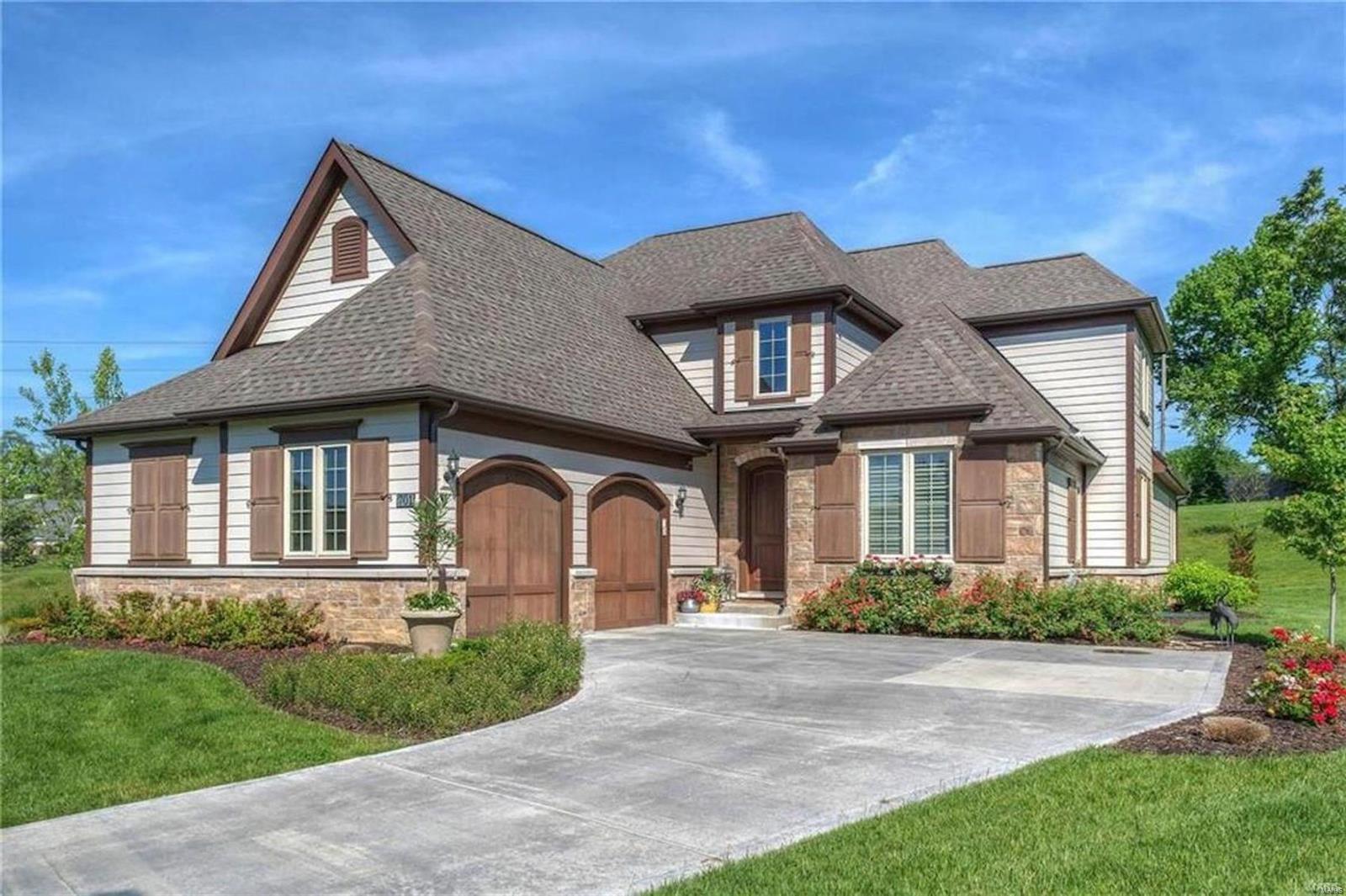 This meticulously maintained home blends modern elegance with functionality offering luxury, low-maintenance living in the Woods of Ladue. Perfectly nestled at the end of the cul-de-sac, it features a grand 2-story foyer leading to an impressive great room w/ custom barn wood ceiling & wall of windows that fill the space with natural light. The open floor plan includes a gourmet kitchen w/ center island & high-end stainless steel appliances, breakfast room, butler’s pantry, formal dining room, & an office/den. The 1st floor primary suite boasts dual walk-in closets & spa-like bath w/ updated shower, double sinks, and soaking tub. Upstairs are 3 spacious bedrooms and a full bath. The finished lower level offers endless opportunities and currently features a professional-grade batting cage, wet bar, 5th bedroom, full bath & plenty of storage. Located within walking distance to award-winning Ladue schools, shops & dining. This move-in ready home combines luxury, convenience, and style. Additional Rooms: Mud Room