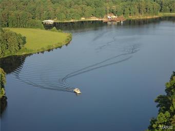 PRICE REDUCED, Buyer Will Consider Any Reasonable Offer!!! Secluded 680 acre ranch, borders National Forest-breathtaking. Stone/Cedar 6,200 sf Lodge, massive beams, wooden & stone throughout interior, massive fireplace, sunken bar. Deep 50 +/- acre Ski Lake, 13# Bass, 45# catfish, 1 ¾# bluegill, boat dock, swim dock, bath houses, white sand beach, & fire pit. Consistently produces trophy 140-175 whitetail deer & turkey. Miles of roads/trails, access to hundreds of miles of horseback trails. 32 acres of pasture, working pens & A+ fencing. $10-15K annualized timber income. Inground pool with pavilion, tennis court, par 3 putting green with two tee boxes. 12,000 sf commercial building; storefront, offices, conference room, and theatre seats 100. 2 add’l 2 BR & 1B houses. Hay barn, stable, dog kennel, equip & tack shed. 90 seat outdoor amphitheater, covered pavilion, 4,500 sq. ft. dance floor. Corporate retreats & weddings, championship designed 21 station sporting clays range.